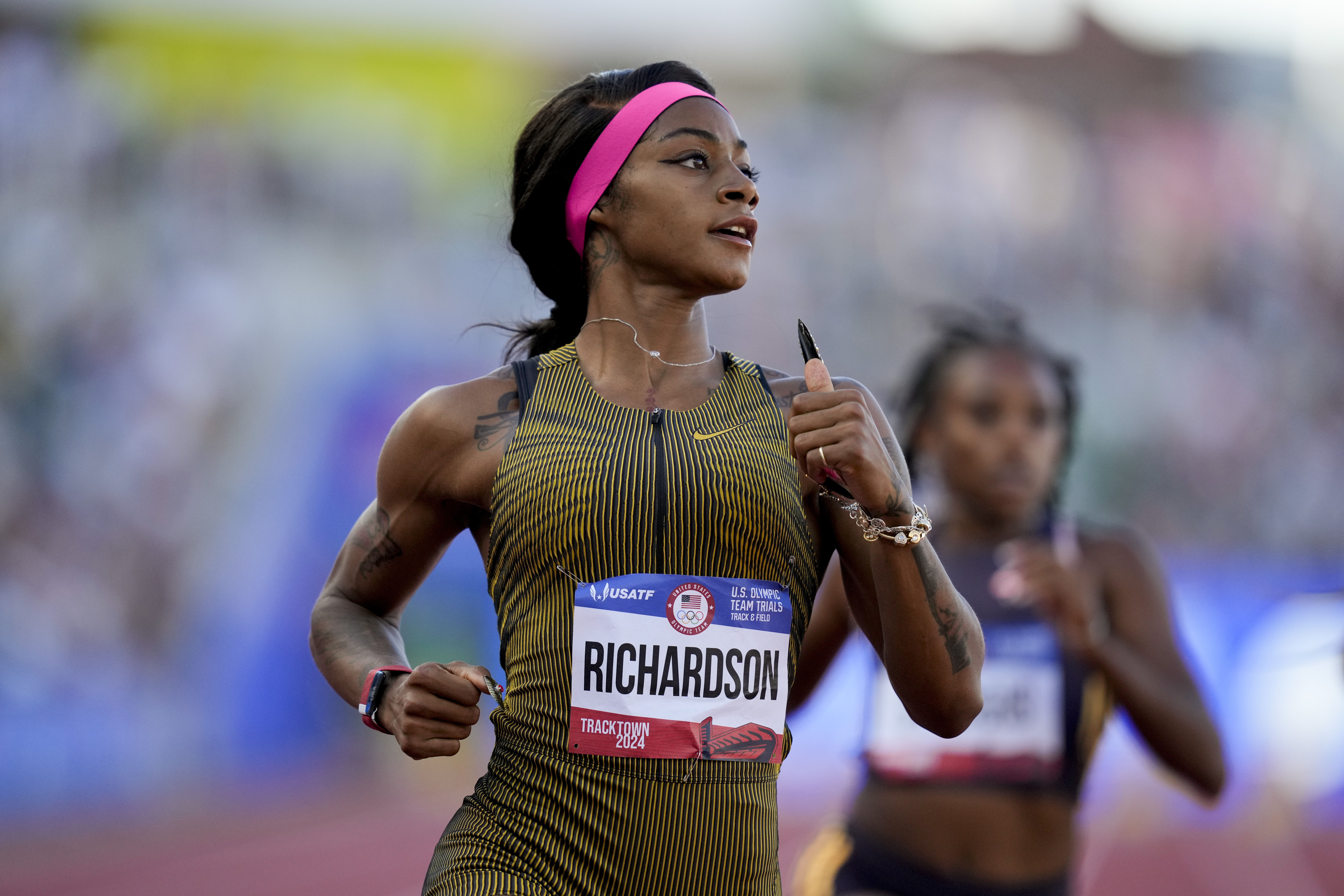 Sha'Carri Richardson wins a heat women's 100-meter run during the U.S. Track and Field Olympic Team Trials Friday, June 21, 2024, in Eugene, Ore. 