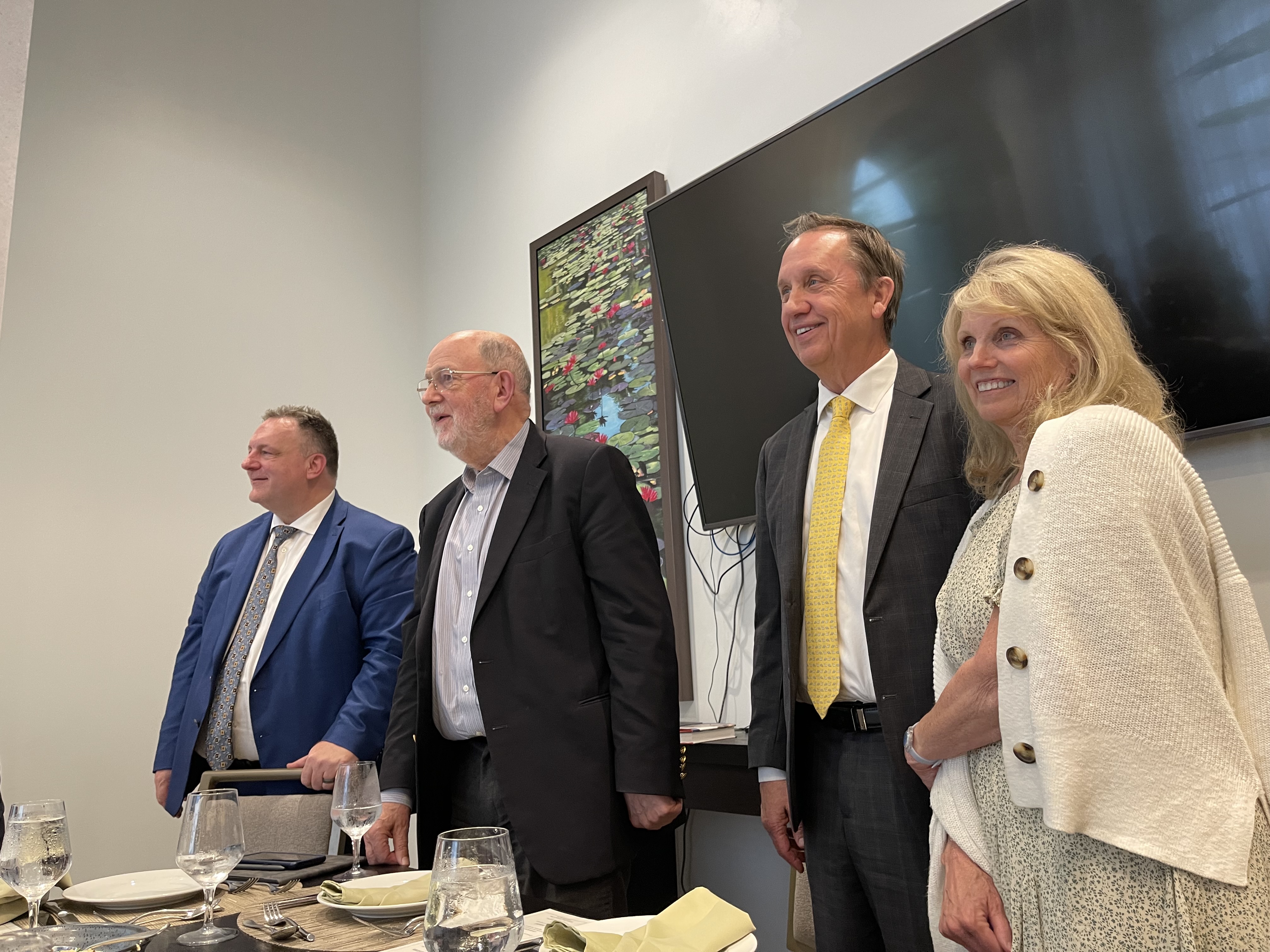 John Esser, founder of the Kaine Ktisis Foundation, stands with renowned British theologian N. T. Wright, Elder Richard Neitzel Holzapfel and Jeni Holzapfel after a question-and-answer session between Wright and religious faculty from BYU and BYU-Idaho in Houston on June 11.