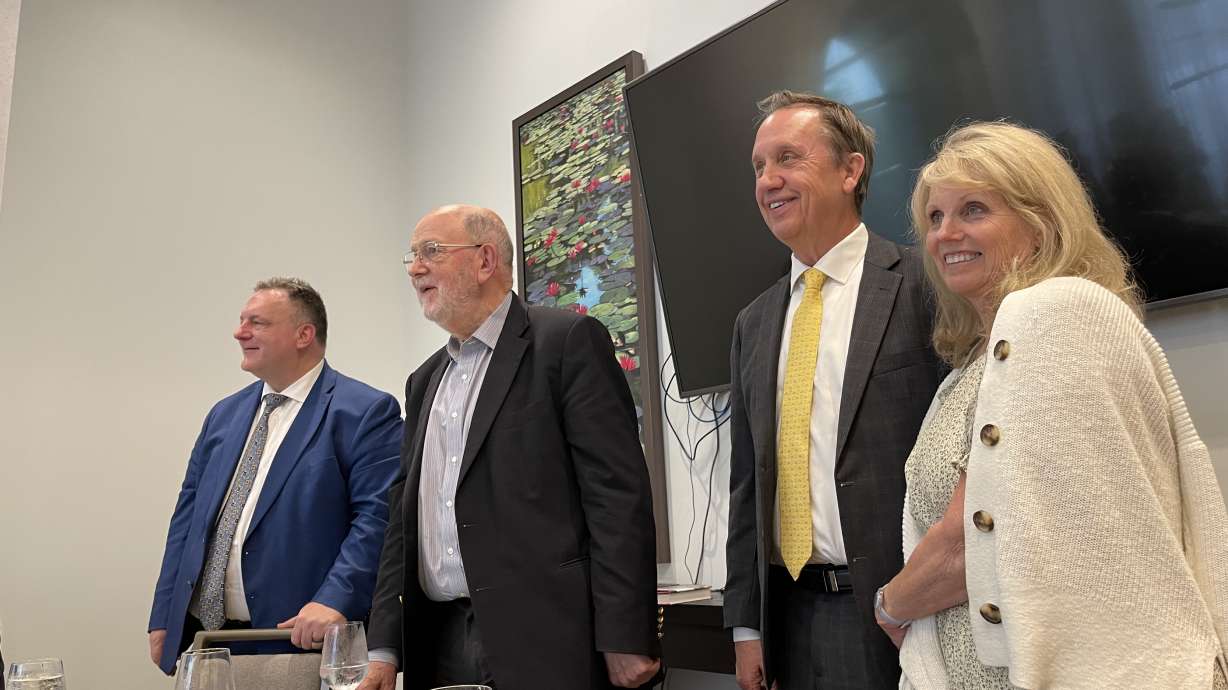 John Esser, founder of the Kaine Ktisis Foundation, stands with renowned British theologian N. T. Wright, Elder Richard Neitzel Holzapfel and Jeni Holzapfel after a question-and-answer session between Wright and religious faculty from BYU and BYU-Idaho in Houston on June 11.