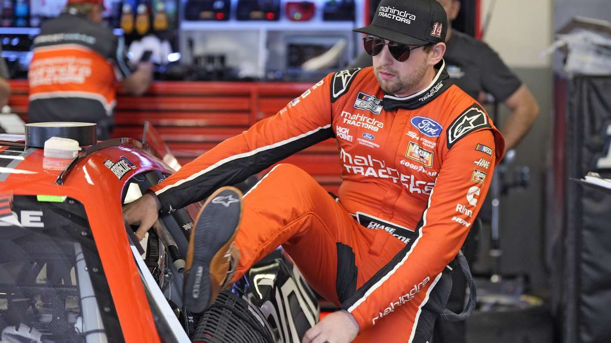 FILE - Chase Briscoe climbs into his car during a practice session for the NASCAR Daytona 500 auto race Friday, Feb. 16, 2024, at Daytona International Speedway in Daytona Beach, Fla. Owners Tony Stewart and Gene Haas announced this week that the four-team garage would cease operations at the end of the season, leaving the future up in the air for Briscoe and teammates Josh Berry, Noah Gragson and Ryan Preece.