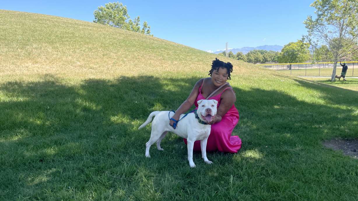 Kendra Keller poses with Pearl, who she and her husband, Husaya Hama, adopted on Saturday. West Valley City Animal Services held a Shelter Saturday event, where people could come to adopt pets in need of a good home.