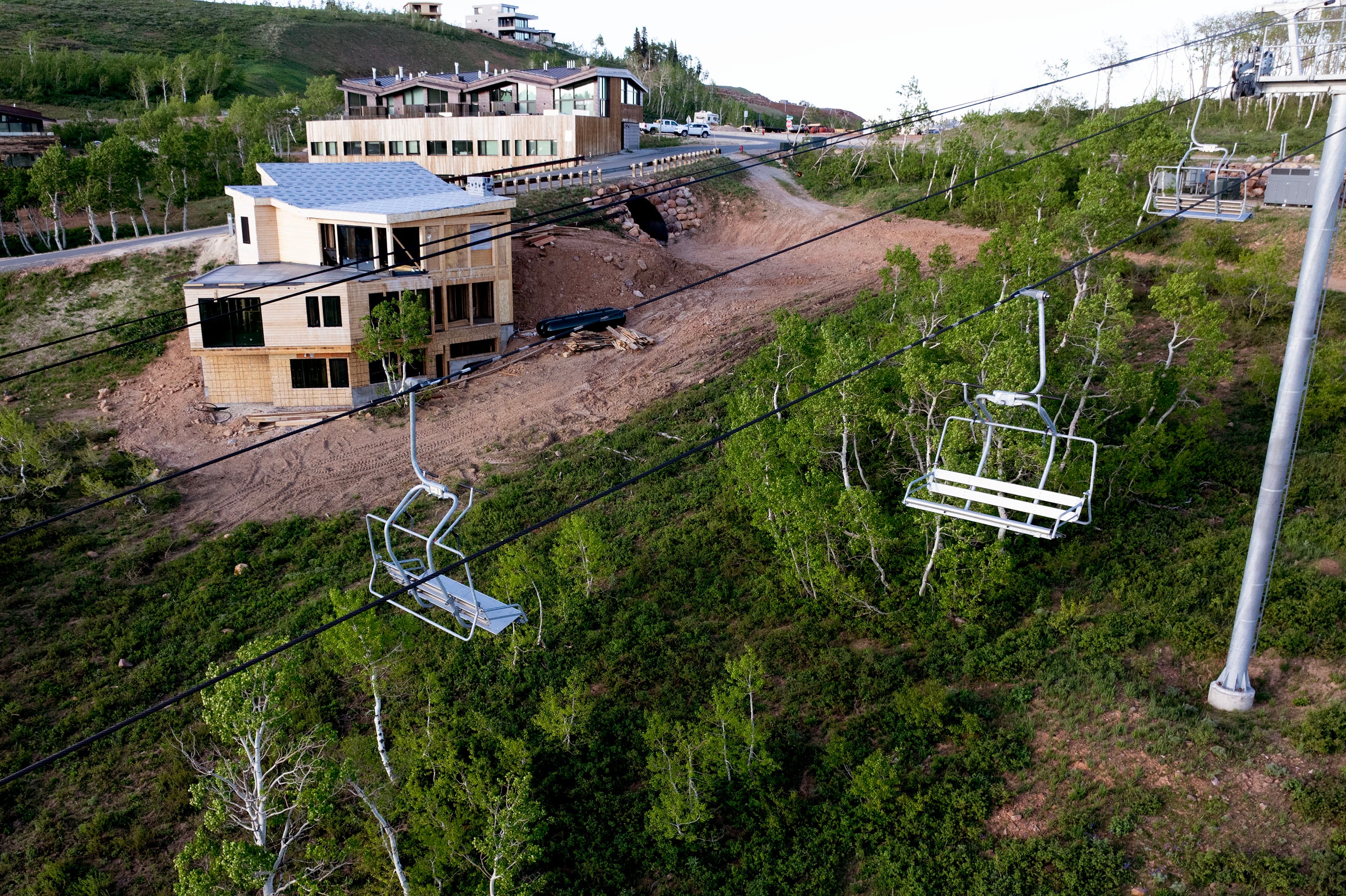 The Village lift is pictured near existing homes and homes under construction on Powder Mountain in Eden on June 14. Powder Mountain announced that it will be moving to a hybrid business model of both public and private slopes for the 2024-25 season. The Village and Mary’s lifts are included in the private skiing.