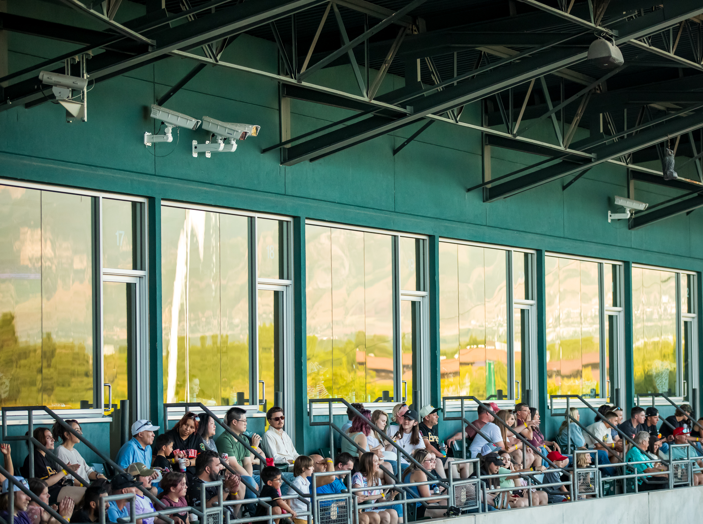 Cameras set up above the Smith's Ballpark box suites help operate the automated ball-strike system that are used to operate challenges during games are pictured during a game on Saturday.