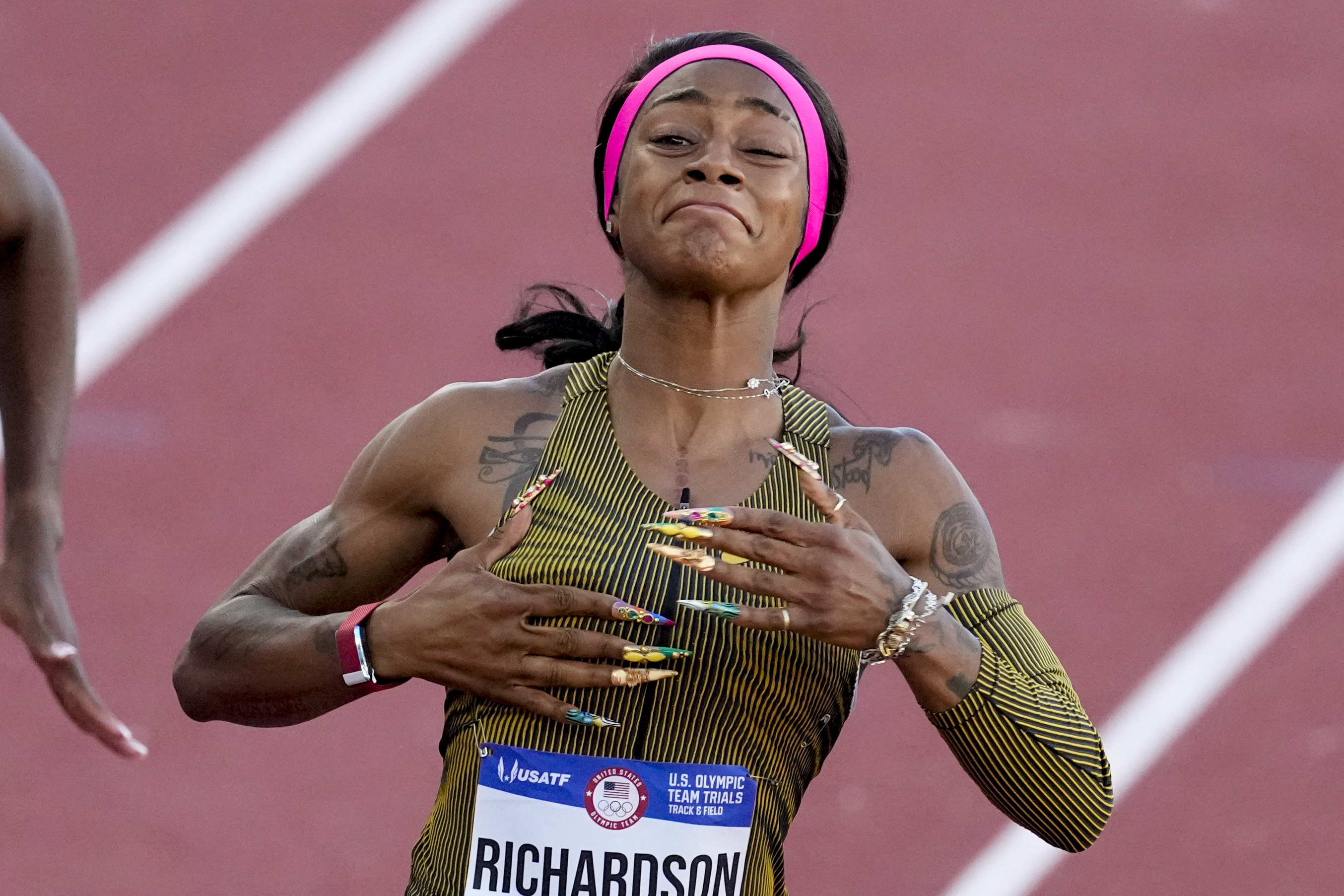 Sha'Carri Richardson celebrates her win in the wins women's 100-meter run final during the U.S. Track and Field Olympic Team Trials Saturday, June 22, 2024, in Eugene, Ore. 