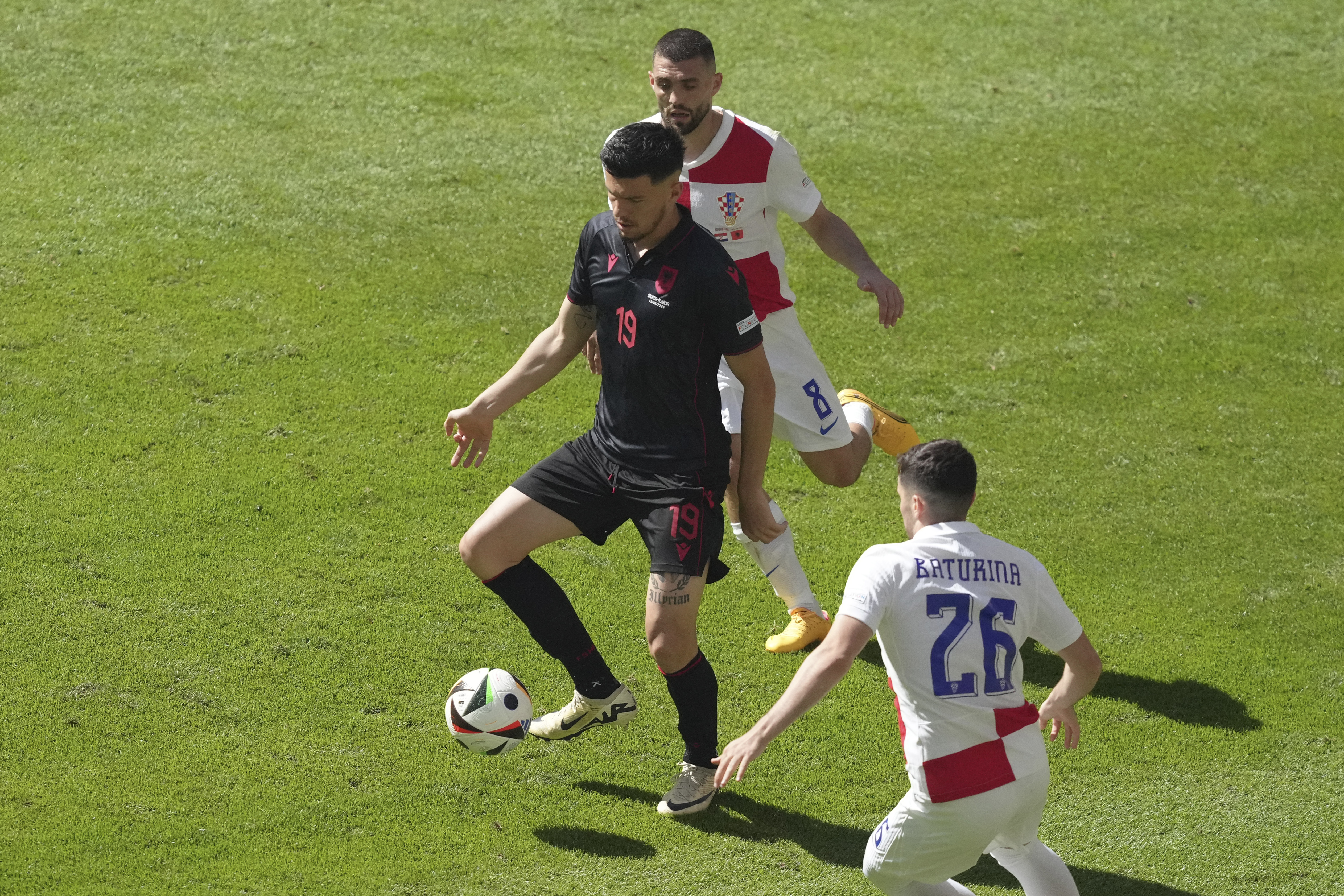 Albania's Mirlind Daku, centre, controls the ball ahead Croatia's Martin Baturina during a Group B match between Croatia and Albania at the Euro 2024 soccer tournament in Hamburg, Germany, Wednesday, June 19, 2024. 