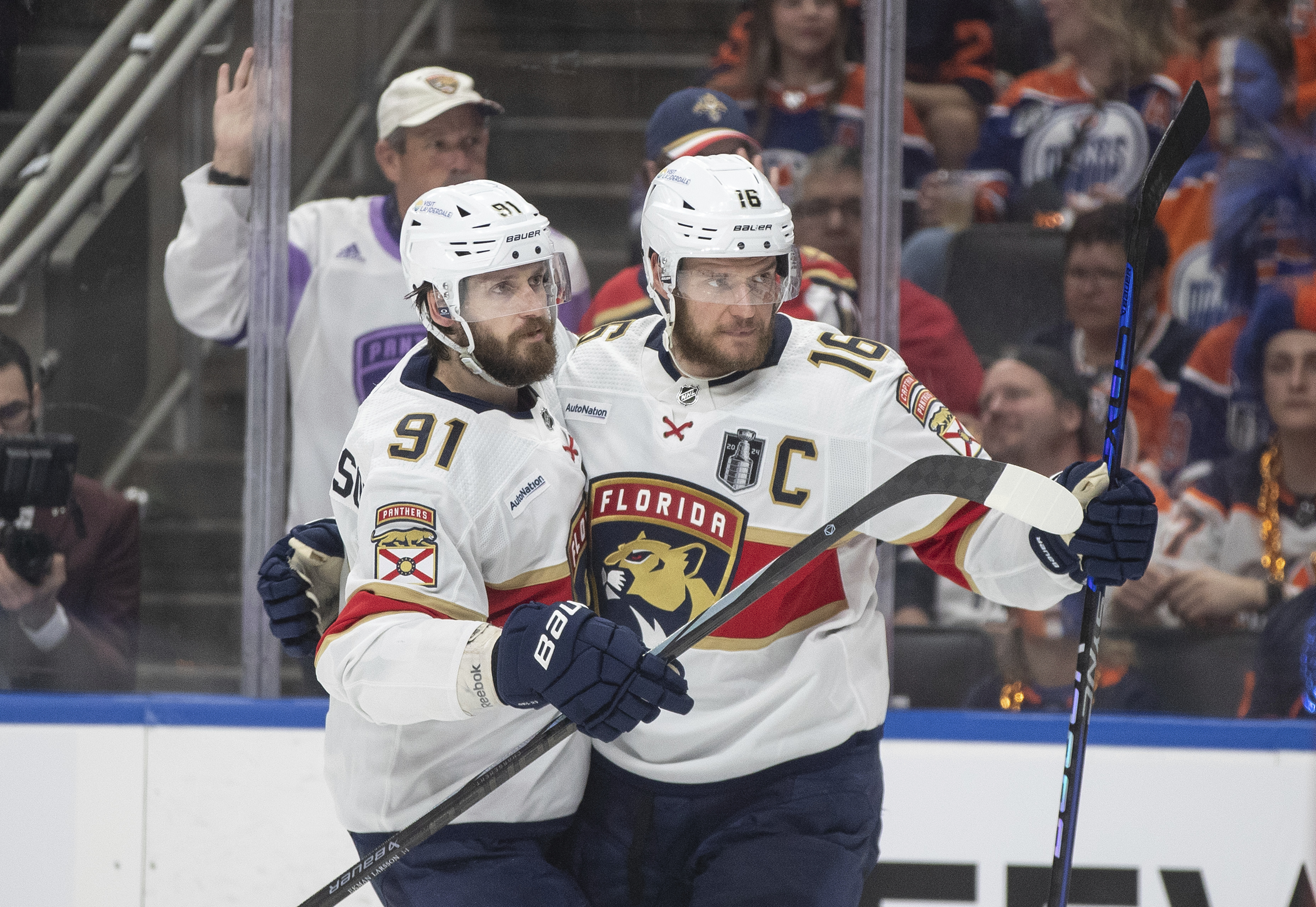 Florida Panthers' Oliver Ekman-Larsson (91) and Aleksander Barkov (16) celebrate after a goal against the Edmonton Oilers during the third period of Game 6 of the NHL hockey Stanley Cup Final, Friday, June 21, 2024, in Edmonton, Alberta. 