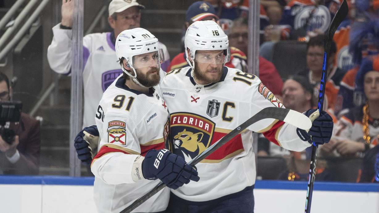 Florida Panthers' Oliver Ekman-Larsson (91) and Aleksander Barkov (16) celebrate after a goal against the Edmonton Oilers during the third period of Game 6 of the NHL hockey Stanley Cup Final, Friday, June 21, 2024, in Edmonton, Alberta.