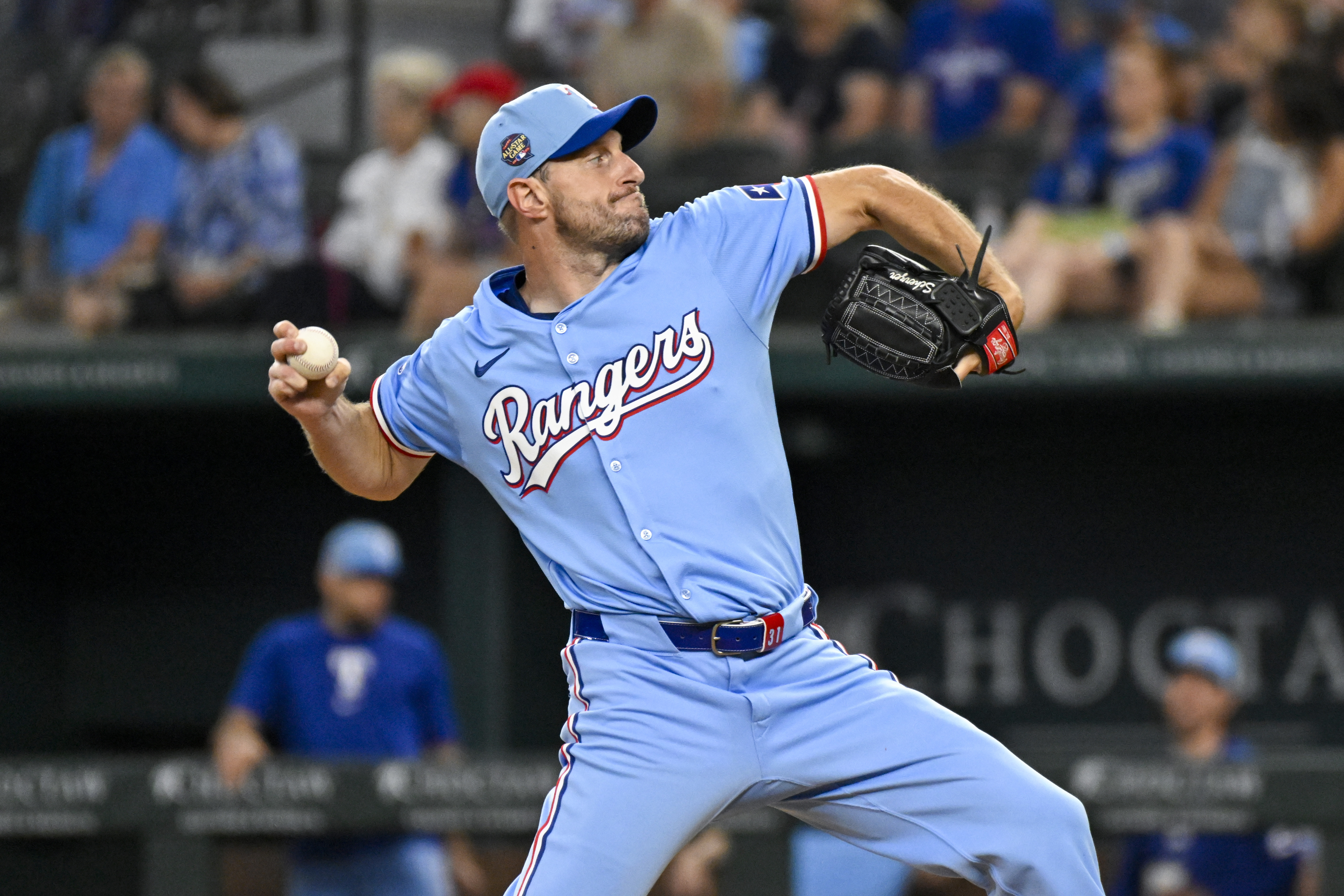 Texas Rangers starting pitcher Max Scherzer throws in his first baseball game back from the injury list in the first inning against the Kansas City Royals, Sunday, June 23, 2024, in Arlington, Texas. 