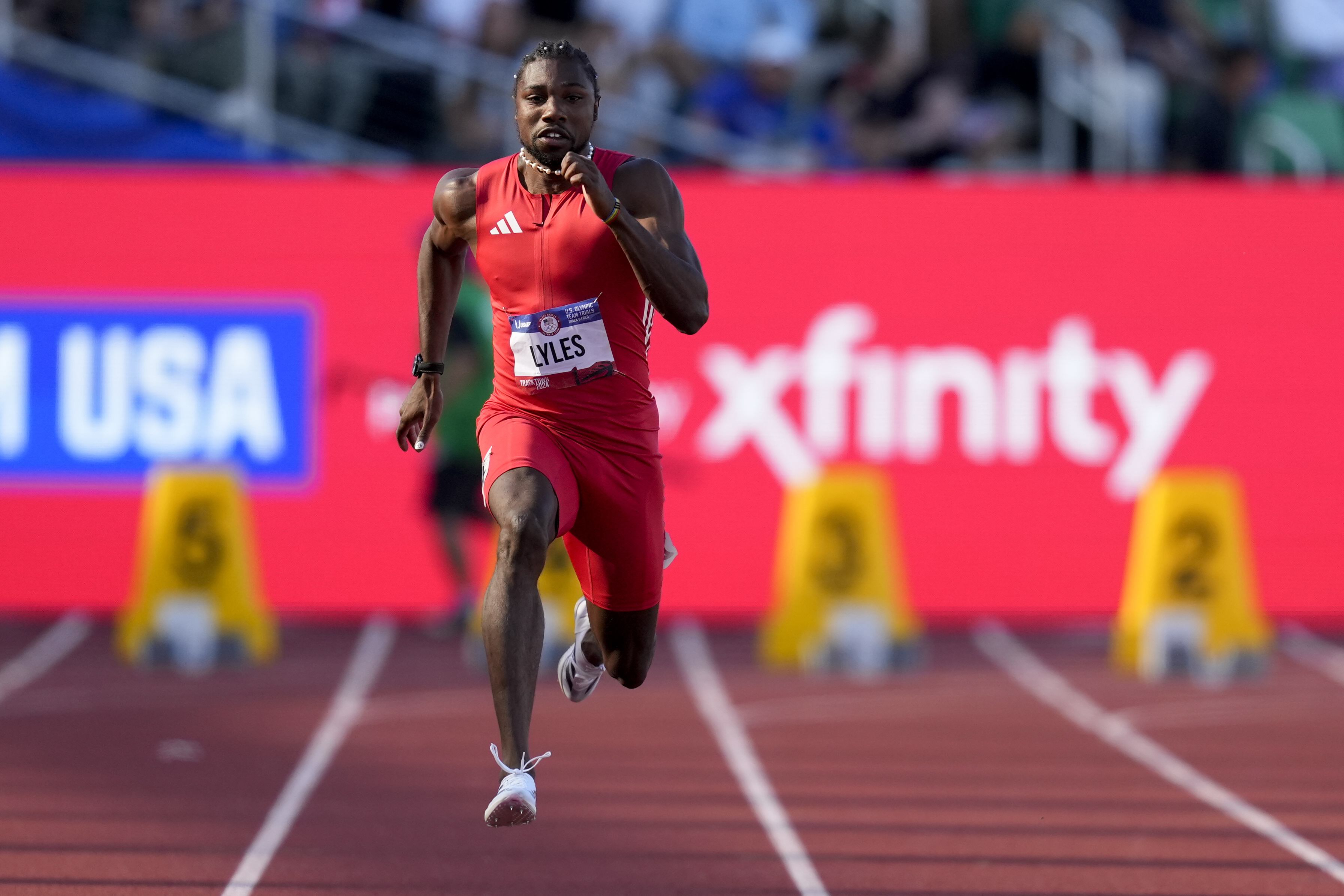 Noah Lyles wins a heat in the men's 100-meter semi-final during the U.S. Track and Field Olympic Team Trials Sunday, June 23, 2024, in Eugene, Ore.
