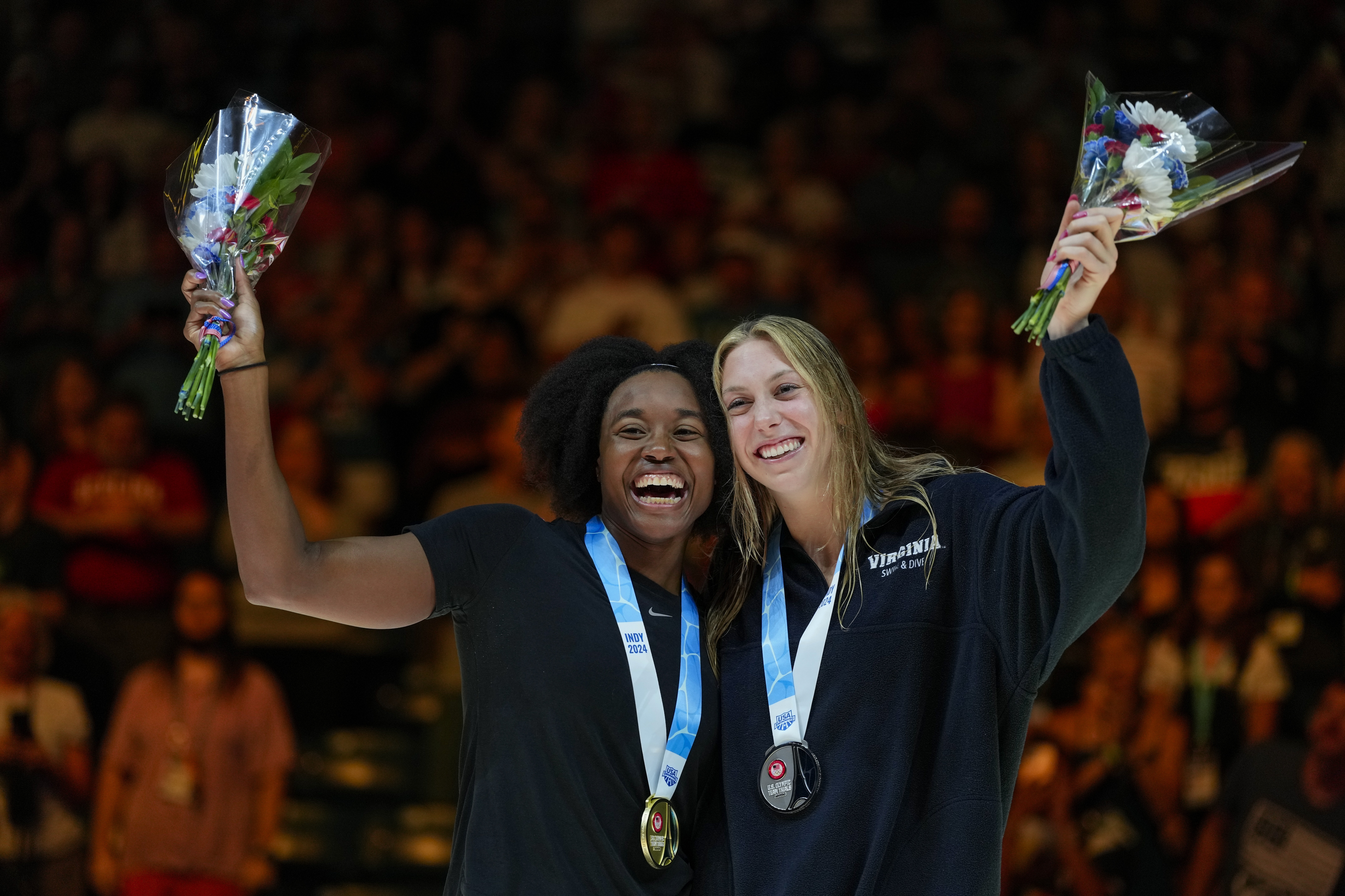 Simone Manuel and Gretchen Walsh celebrate after the Women's 50 freestyle finals Sunday, June 23, 2024, at the US Swimming Olympic Trials in Indianapolis. 