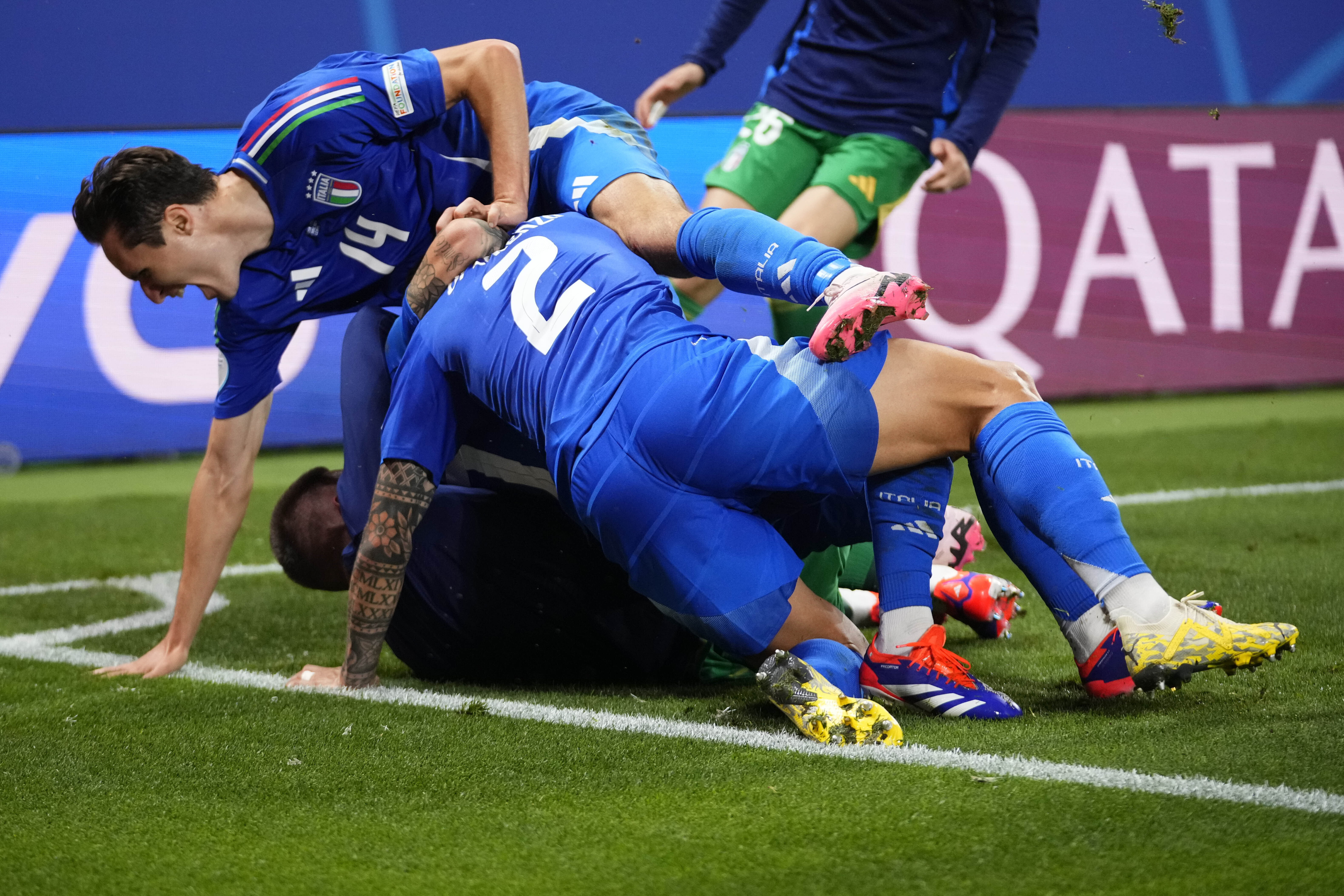 Italian players celebrate after teammate Mattia Zaccagni scored during a Group B match between Croatia and Italy at the Euro 2024 soccer tournament in Leipzig, Germany, Monday, June 24, 2024.