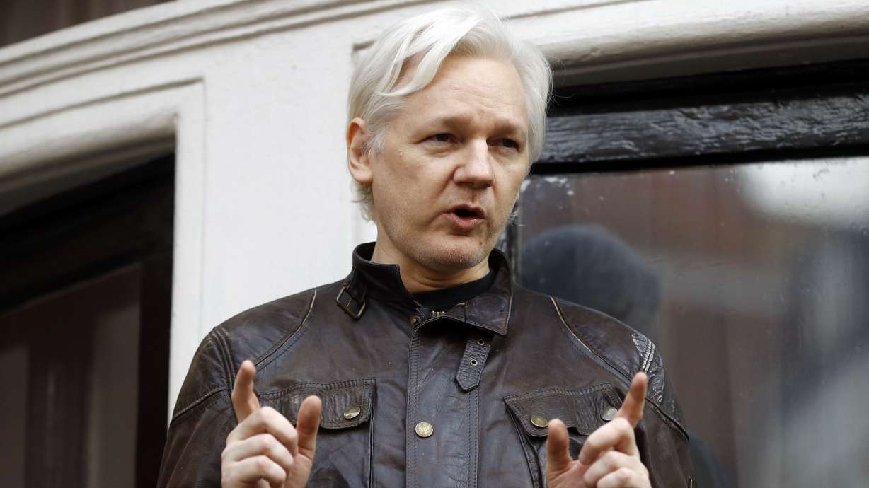 Julian Assange speaks to the media outside the Ecuadorian embassy in London, May 19, 2017. Assange will plead guilty to a felony charge in a deal with the U.S. Justice Department that will free him from prison and resolve a long-running legal saga over the publication of a trove of classified documents.
