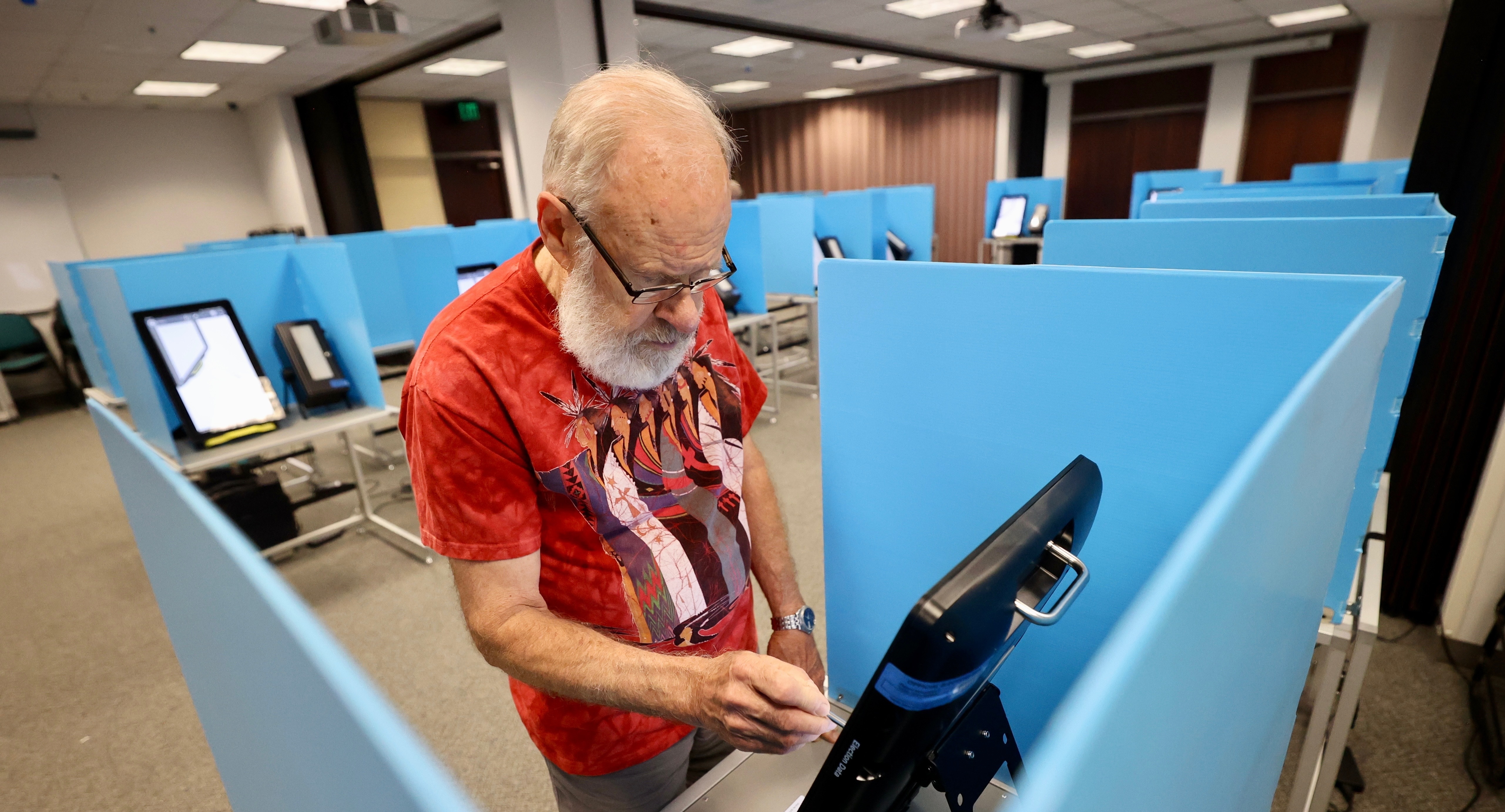 Terry Swanson casts his vote Tuesday in the primary elections, Tuesday at the Salt Lake County Government Center in Salt Lake City. Primary election day is Tuesday.