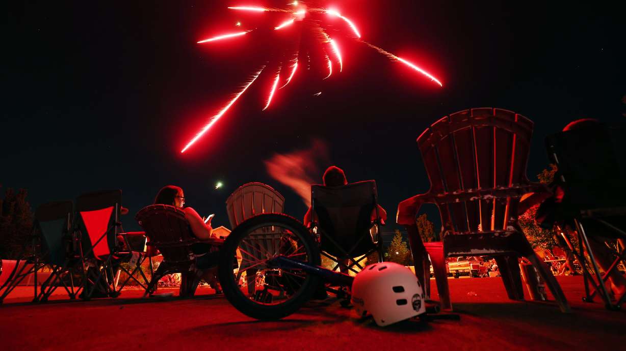 Herriman residents watch fireworks on July 4, 2022. Cities across Utah have plans to celebrate the holiday this year.
