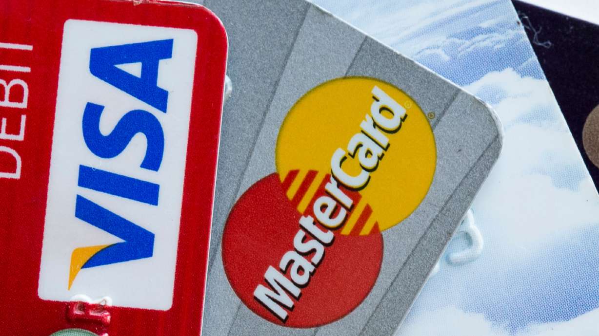 A federal judge overseeing a $30 billion preliminary swipe-fees settlement between Mastercard, Visa and retailers formally rejected the deal Tuesday.