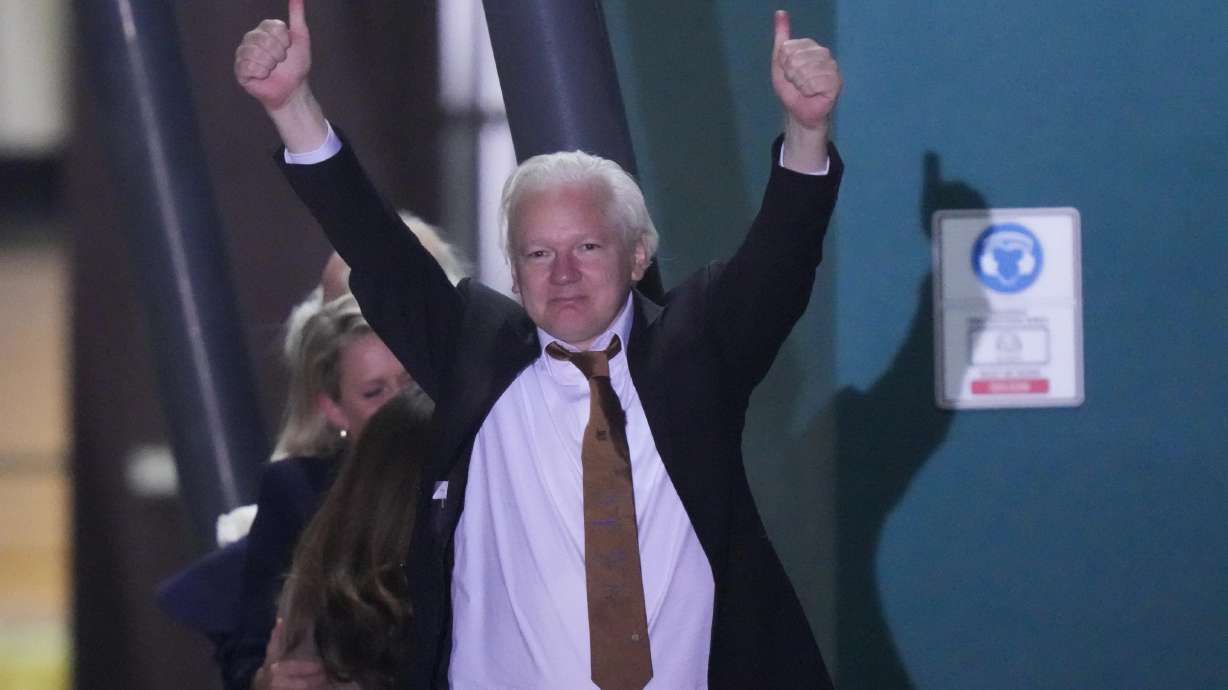 Julian Assange arrives in Canberra, Australia, on Wednesday. The WikiLeaks founder returned to his homeland after pleading guilty to breaking U.S. law.