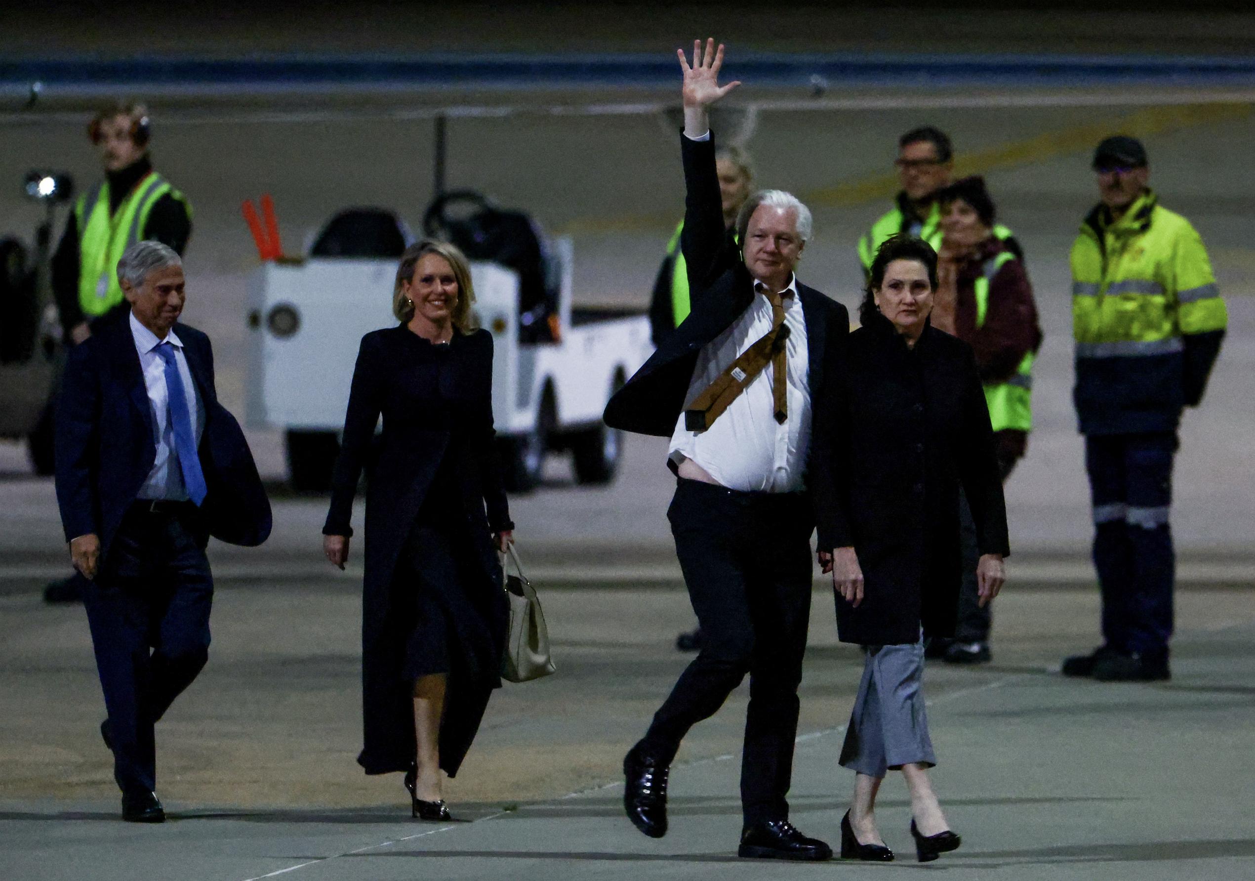 WikiLeaks founder Julian Assange waves as he arrives in Canberra, Australia, Wednesday.