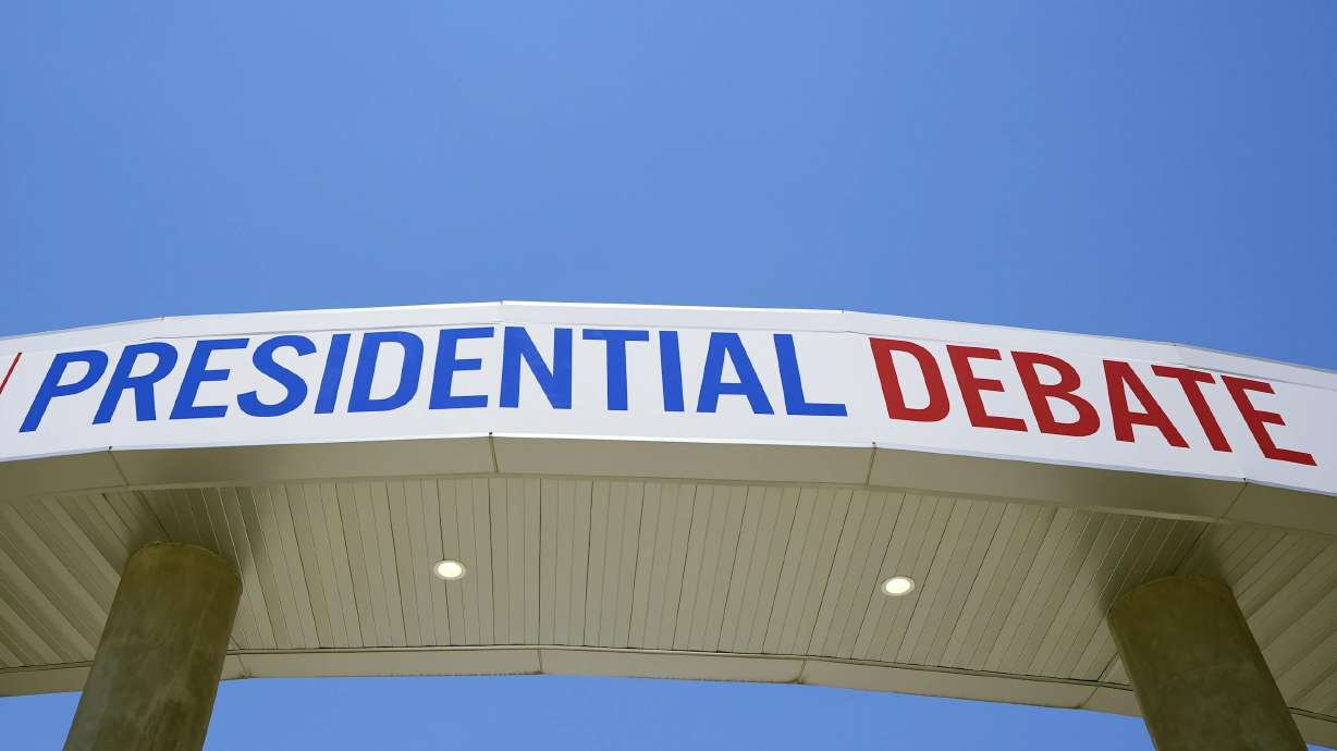 Sign for the upcoming presidential debate near the CNN Techwood campus in Atlanta on Tuesday. A new poll finds that most U.S. adults plan to watch or listen to some element of Thursday’s presidential debate.