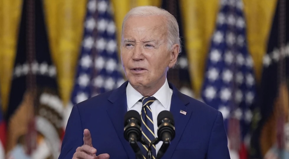 President Joe Biden speaks in the East Room at the White House in Washington, June 4.  Biden is pardoning potentially thousands of former U.S. service members convicted of violating a now-repealed military ban.