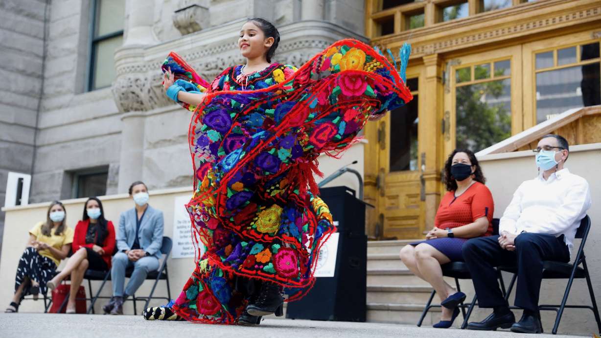Mili Silos performs a traditional dance at the Salt Lake City-County Building to mark Hispanic Heritage Month on Sept. 15, 2021. The expansion of the Latino population has been key in Utah's growth and now represents 16% of Utah's overall population.