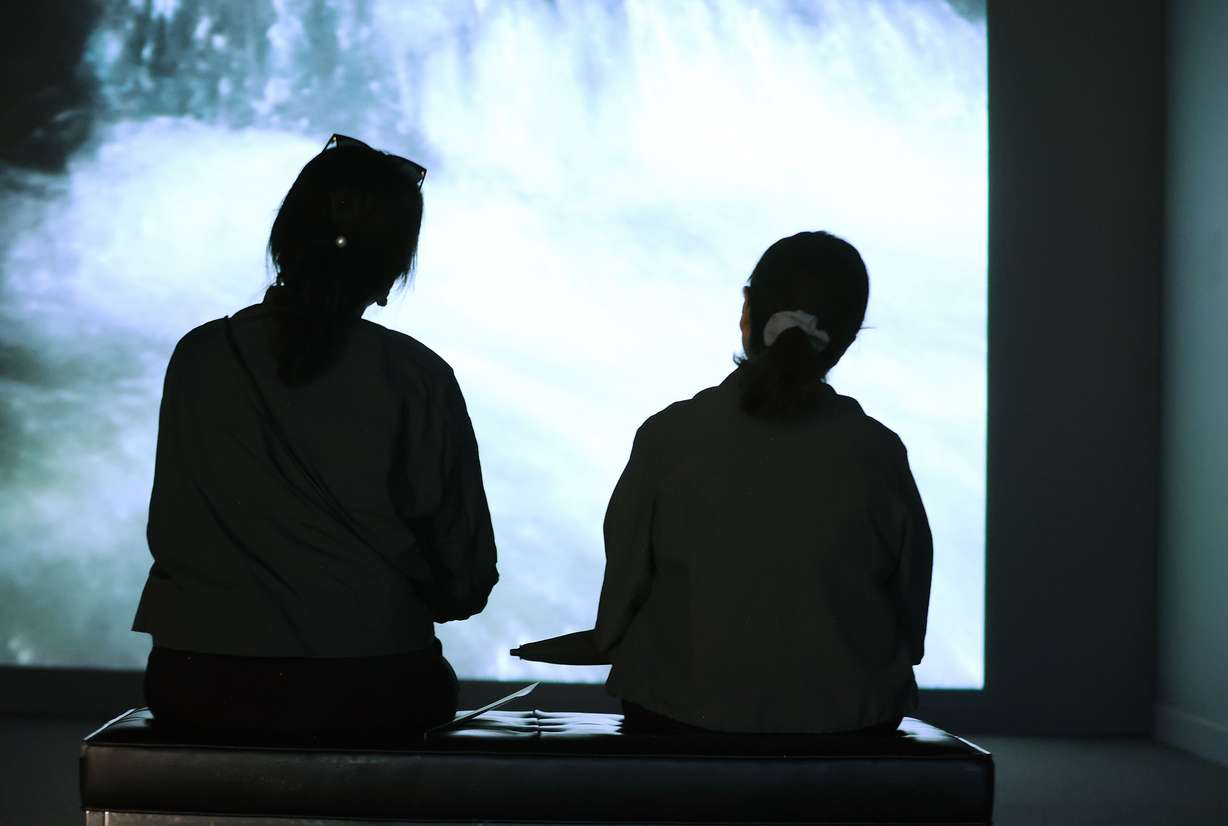 Patrons view a video exhibit at the Utah Museum of Contemporary Art in Salt Lake City on Wednesday,