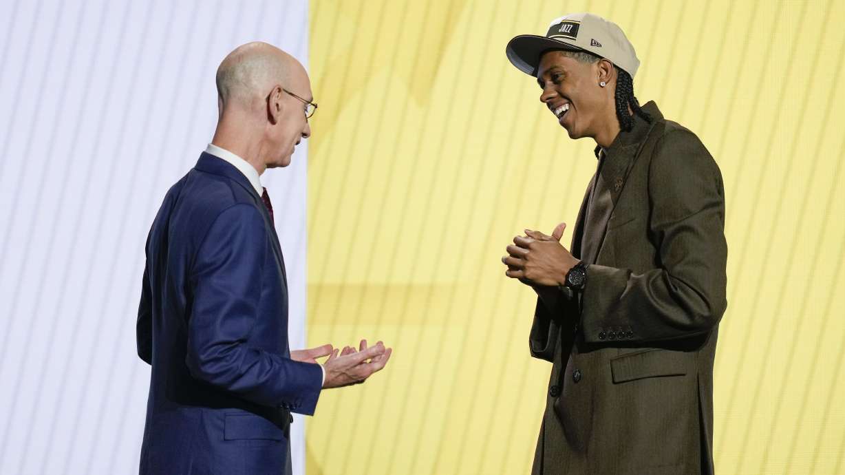 Cody Williams, right, greets NBA commissioner Adam Silver after being selected by the Utah Jazz as the 10th pick during the first round of the NBA basketball draft, Wednesday, June 26, 2024, in New York.