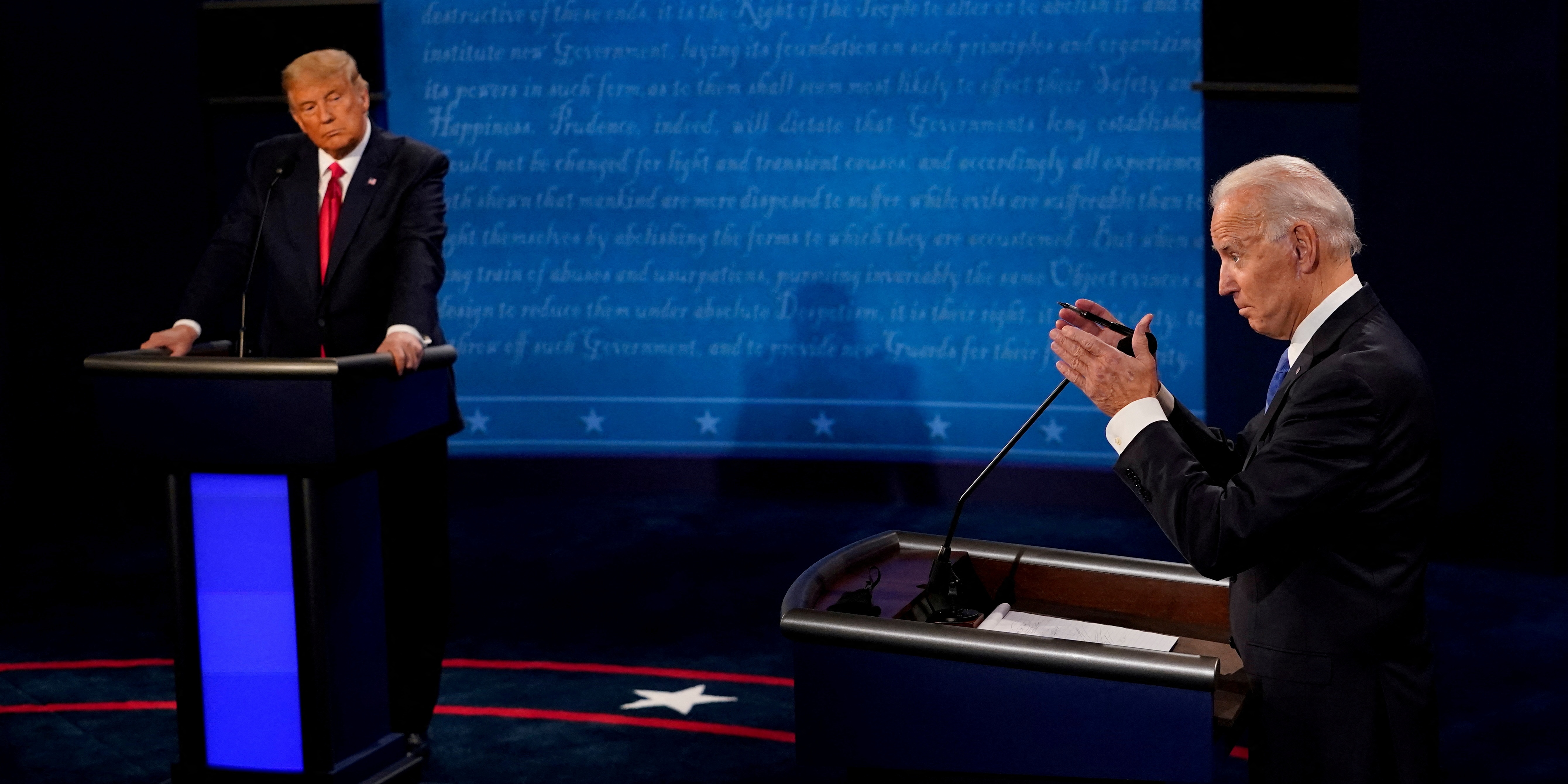 Democratic presidential candidate former Vice President Joe Biden answers a question as President Donald Trump listens during a presidential debate at Belmont University in Nashville, Tenn., Oct. 22, 2020. Investors watching Thursday's presidential debate hope to hear thoughtful positions.