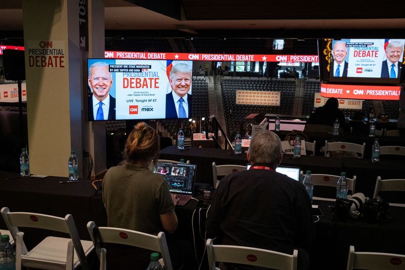 Media crews work at the press room in the McCamish Pavilion on the Georgia Institute of Technology campus ahead of the first 2024 presidential debate between Democratic presidential candidate President Joe Biden and Republican presidential candidate former president Donald Trump in Atlanta, Ga., Thursday.