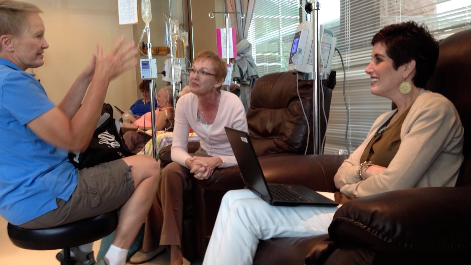 Gaylene Greener, right, speaks with her health care professional about her cancer treatment in Ogden, in this undated photo.