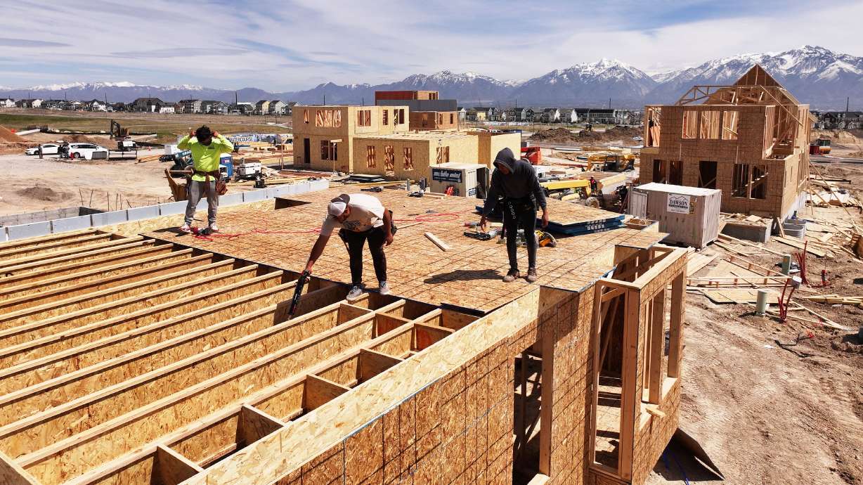 Workers frame a home in Daybreak April 19. Census Bureau data released Thursday shows some of Utah's metro areas have the fastest-growing working-age population in the country.