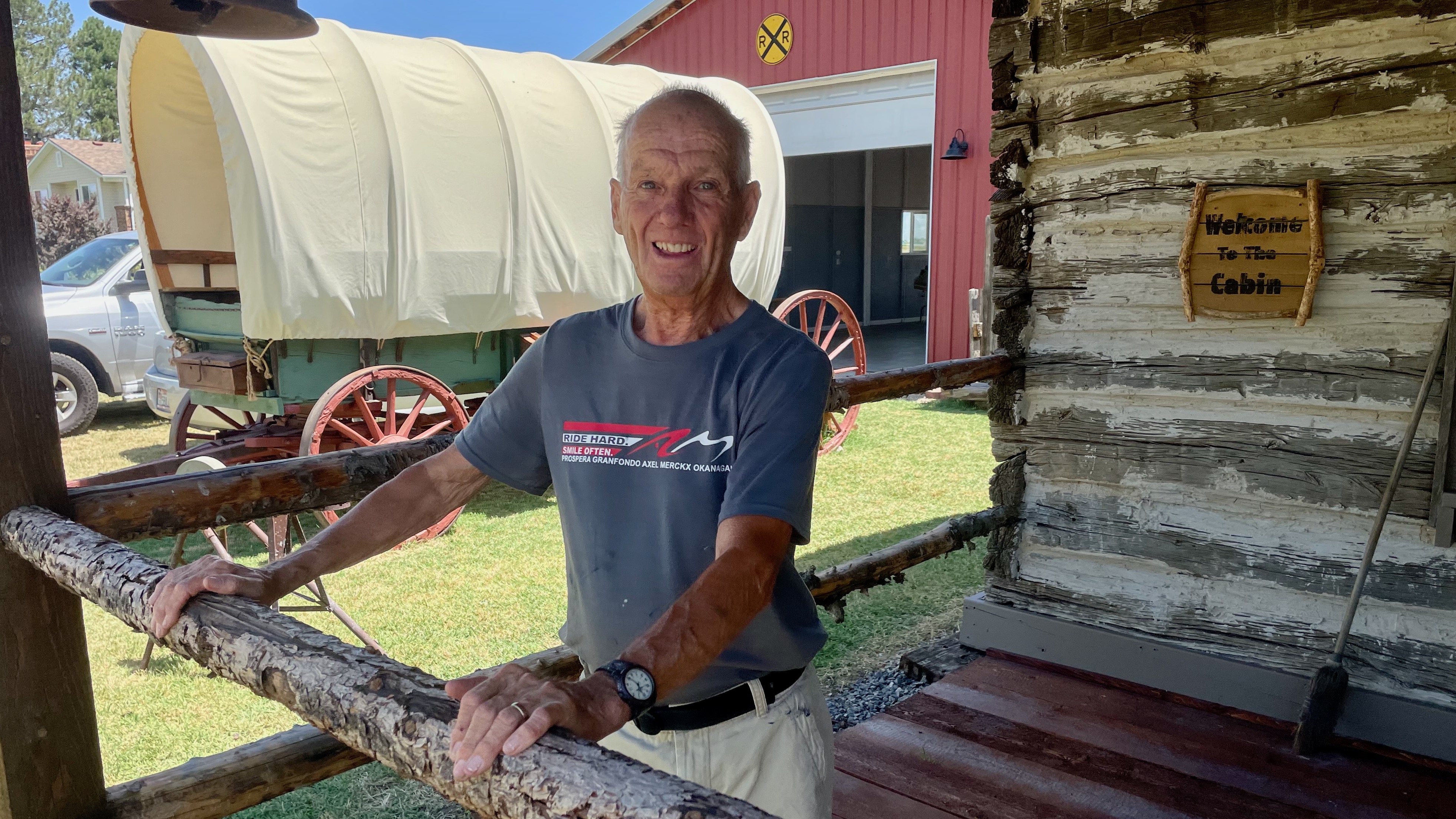 Michael Ackley stands Tuesday outside an 1870s-era home transplanted to Ackley Western Town, the Old West museum he built on the grounds of his home in Taylor.