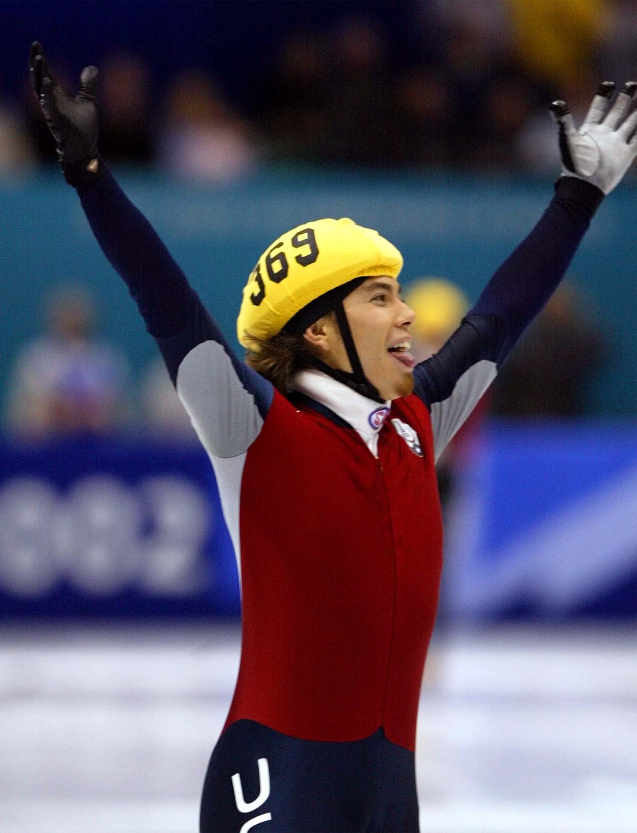 Apollo Ohno celebrates his gold medal victory in the 1,500-meter shot track speedskating race Feb 20, 2002, at the Salt Lake Ice Center.