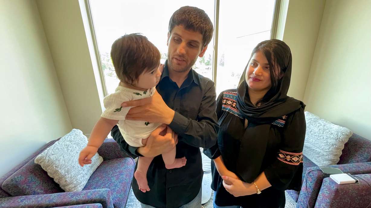 Laila Basim, with her husband Shakibra Rahimi and 4-month-old daughter Adokht, at their Salt Lake City home on Thursday.