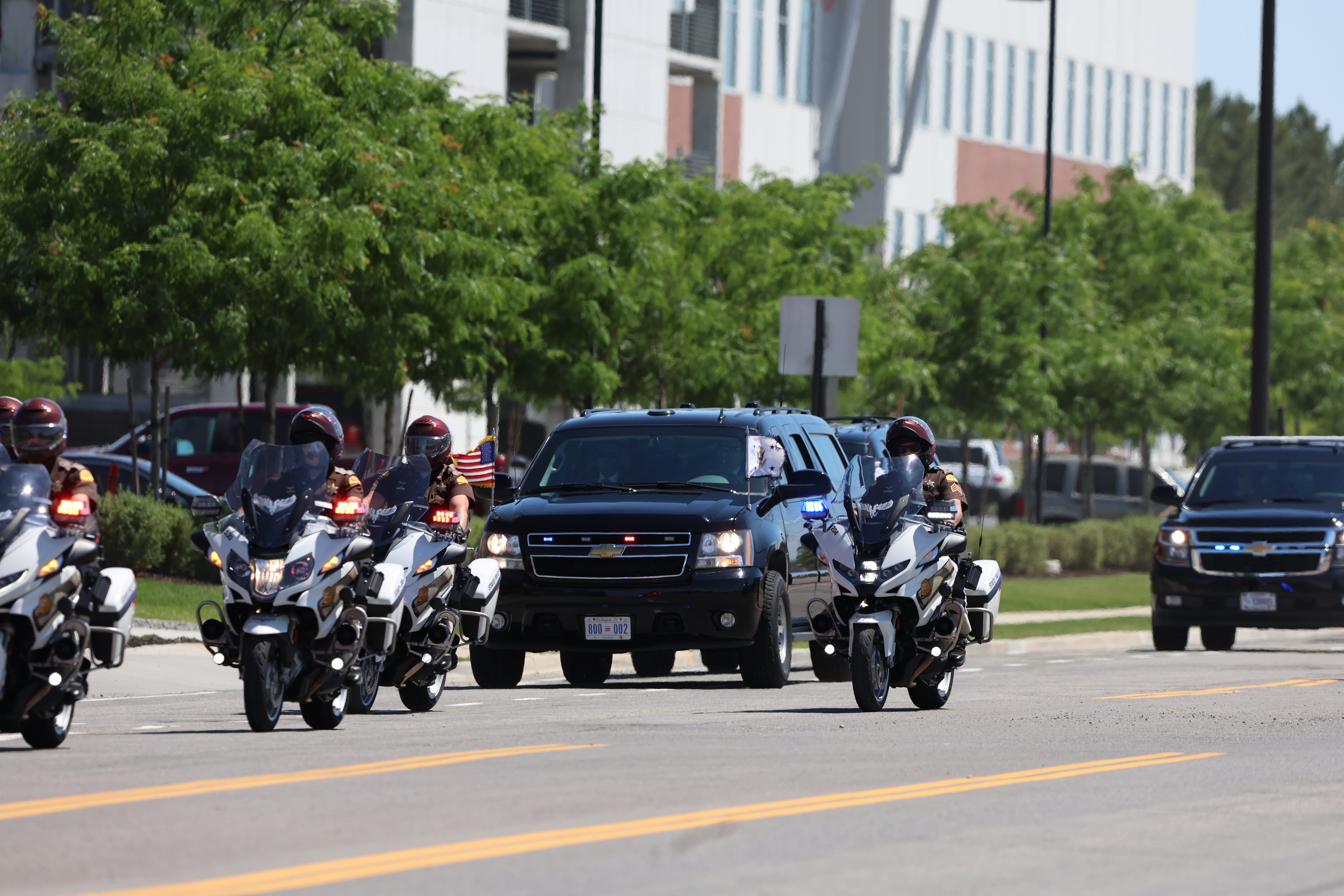 A motorcade carrying Vice President Kamala Harris drives up 2200 West in Salt Lake City on Friday