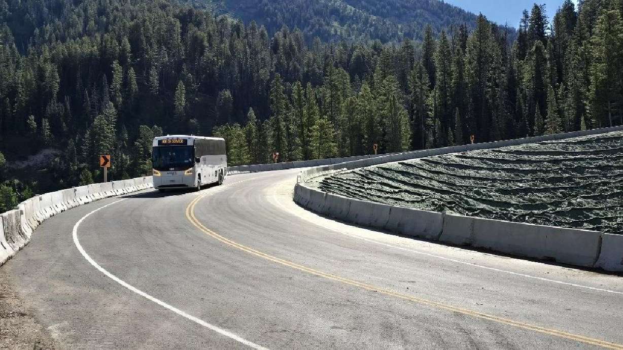 A tour bus travels through Wyoming Highway 22/Teton Pass on Friday. The highway reopened with a small temporary detour that bypasses a section of the road that collapsed earlier this month.