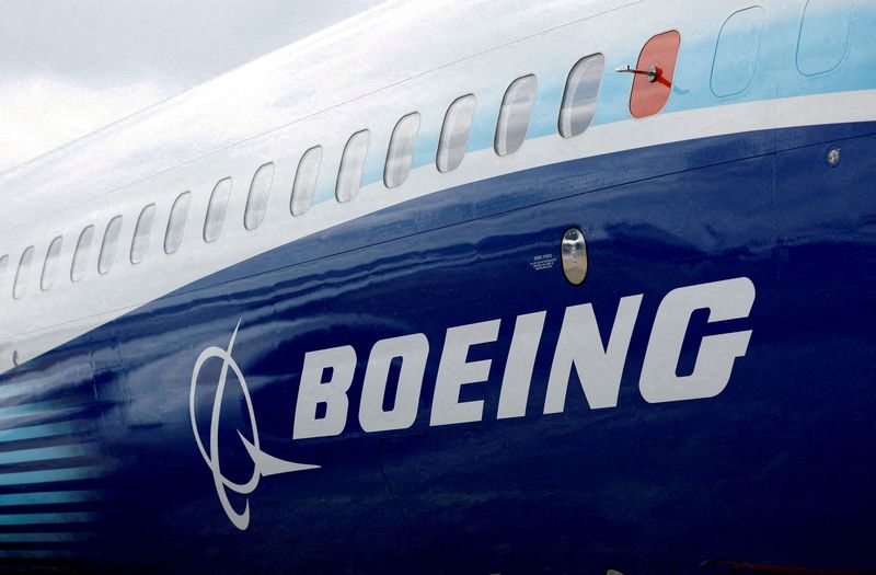 The Boeing logo is seen on the side of a Boeing 737 MAX at the Farnborough International Airshow, in Farnborough, Britain, July 20, 2022.