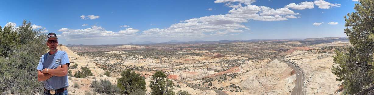 At Head of the Rocks Overlook on Highway 12, Garfield County mailman Tracy Sidwell is flanked by the road that meanders through Grand Staircase-Escalante National Monument. He's carried the mail over the route six days a week for the past 30 years.