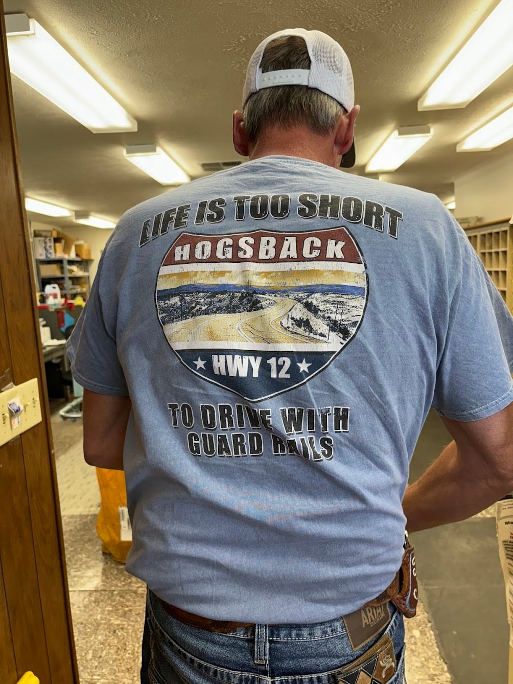 Garfield County mailman Tracy Sidwell's "work" T-shirt celebrates the fabled Highway 12 hogsback.