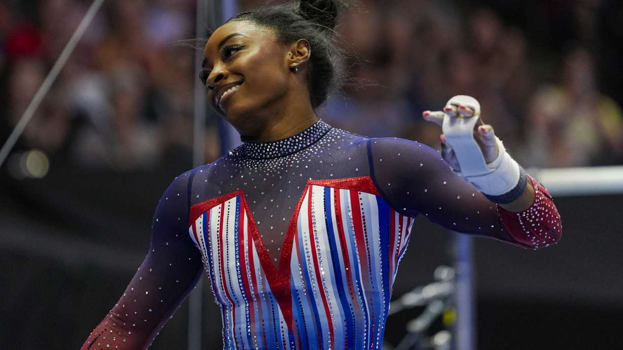 Simone Biles competes on the uneven bars at the United States Gymnastics Olympic Trials on Sunday, June 30, 2024, in Minneapolis.
