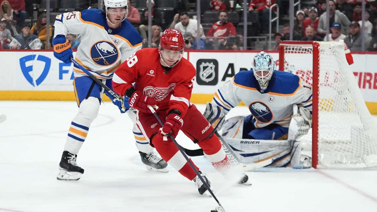 FILE - Detroit Red Wings right wing Patrick Kane (88) skates with the puck as Buffalo Sabres' Owen Power (25) defends with goaltender Ukko-Pekka Luukkonen (1) in the second period of an NHL hockey game April 7, 2024, in Detroit. Hundreds of millions of dollars will be committed to free agents, including a strong crop of forwards led by longtime Tampa Bay captain Steven Stamkos, 2023 playoff MVP Jonathan Marchessault and three-time Stanley Cup champion Kane.