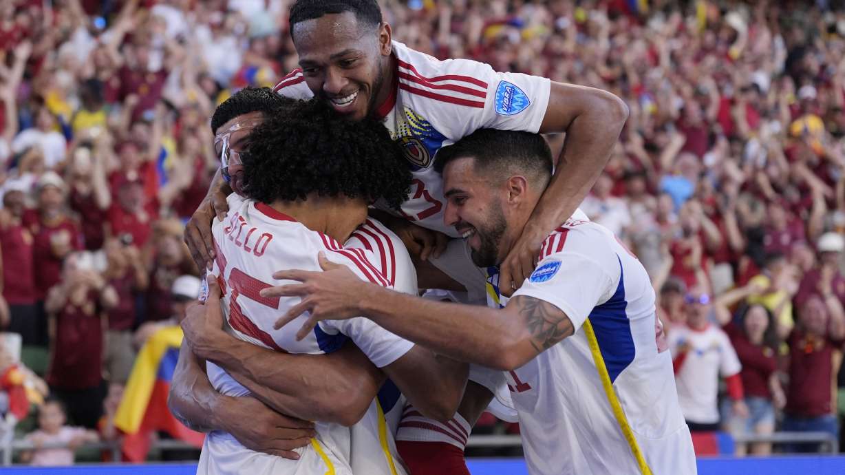 Venezuela's Eduard Bello, left, celebrates with teammates after scoring a second half goal during a Copa America Group B soccer match between Jamaica and Venezuela, Sunday, June 30, 2024, in Austin, Texas.