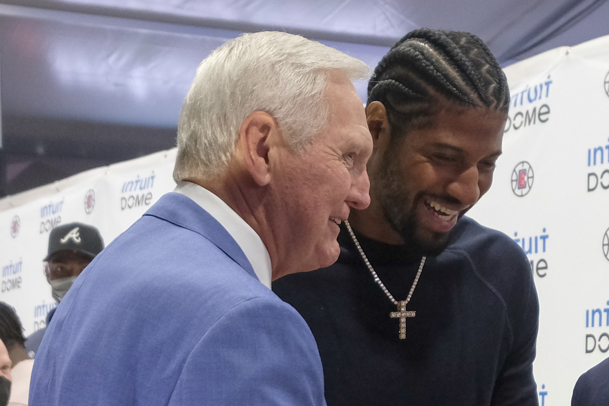 FILE - Los Angeles Clippers star Paul George, right, and Jerry West attend a groundbreaking ceremony of the Intuit Dome, Sept. 17, 2021, in Inglewood, Calif. The two-day NBA draft was tinged with sadness for the Clippers, who were without West in their war room. West spent the last seven years as a consultant for the team, helping recruit Kawhi Leonard and George. The Hall of Famer died June 12 at age 86. 