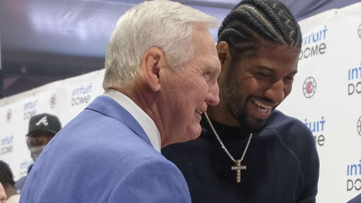FILE - Los Angeles Clippers star Paul George, right, and Jerry West attend a groundbreaking ceremony of the Intuit Dome, Sept. 17, 2021, in Inglewood, Calif. The two-day NBA draft was tinged with sadness for the Clippers, who were without West in their war room. West spent the last seven years as a consultant for the team, helping recruit Kawhi Leonard and George. The Hall of Famer died June 12 at age 86.