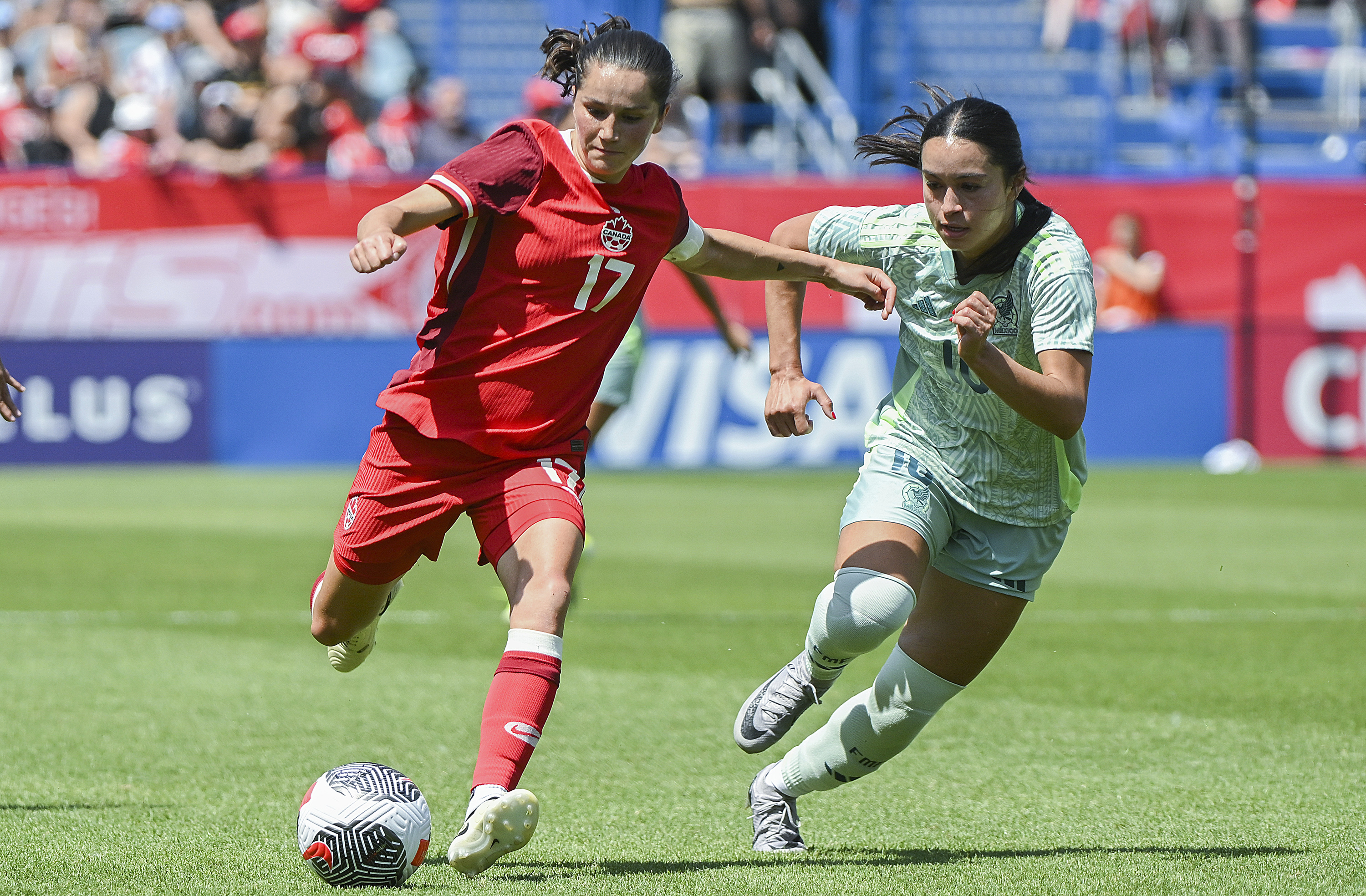 FILE - Canada's Jessie Fleming (17) breaks away from Mexico's Scarlett Camberos 