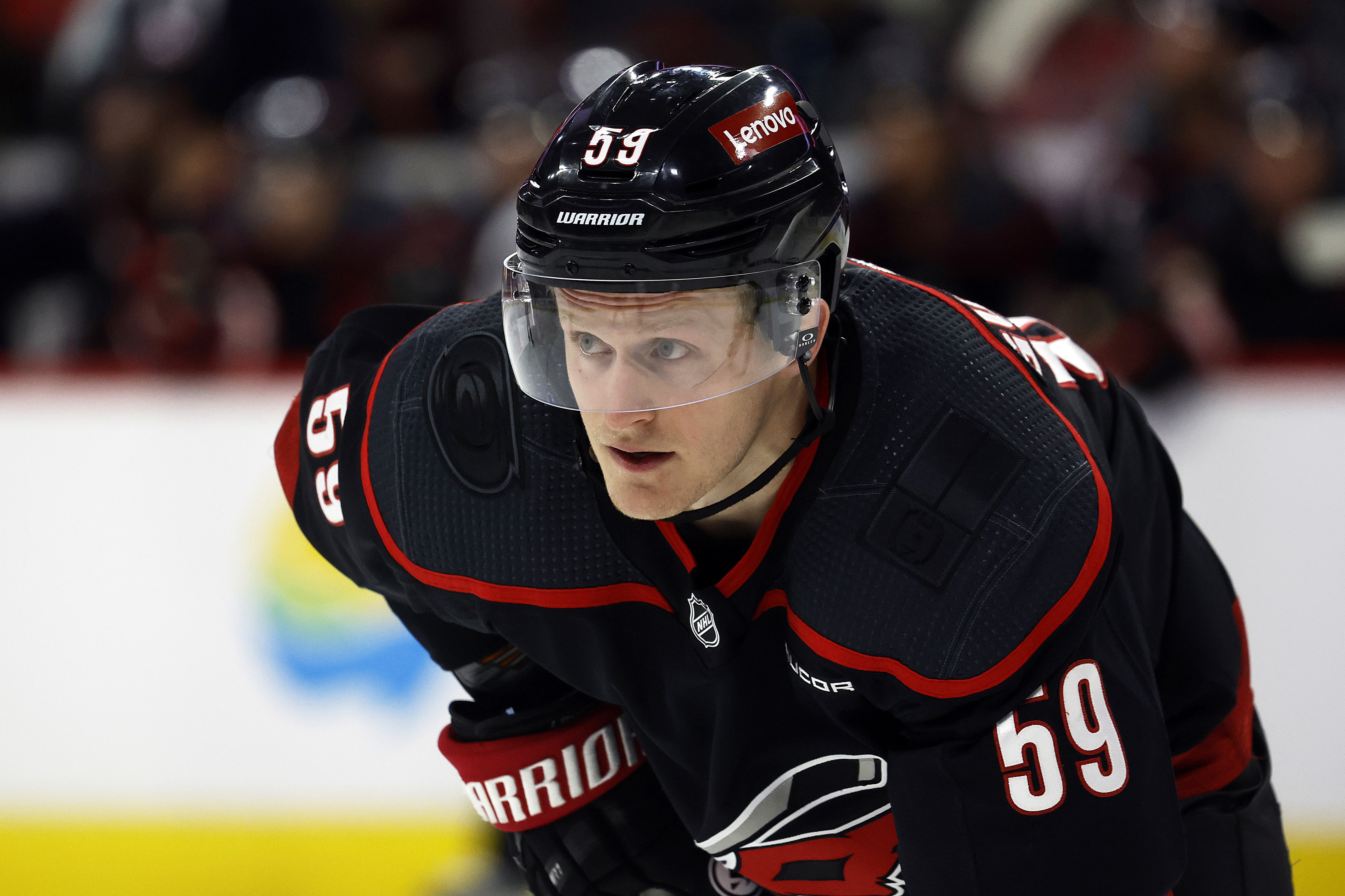 FILE - Carolina Hurricanes' Jake Guentzel (59) watches the puck during the second period of an NHL hockey game against the Boston Bruins in Raleigh, N.C., April 4, 2024. The Tampa Bay Lightning got a head start on free agency by acquiring the rights to high-scoring winger Guentzel. The Lightning sent a 2025 third-round draft pick to Carolina on Sunday, June 30.