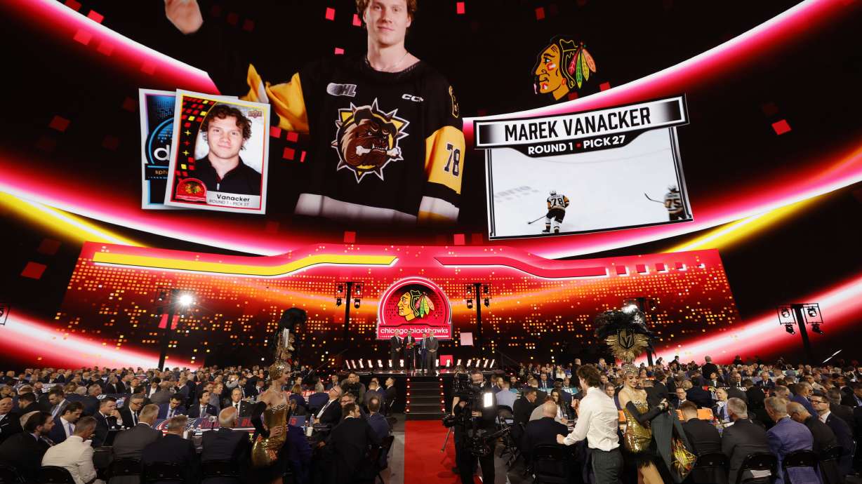 Marek Vanacker heads to the podium after being selected by the Chicago Blackhawks during the first round of the NHL hockey draft Friday, June 28, 2024, in Las Vegas.