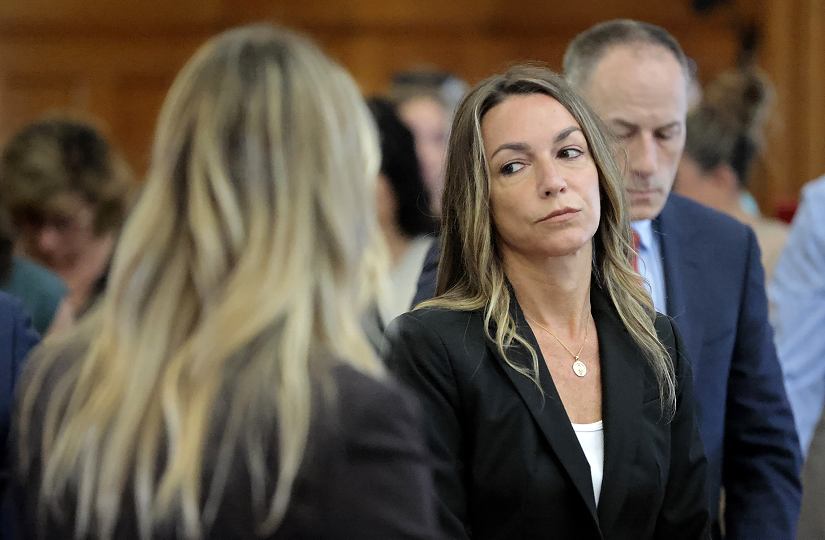 All stand as the jury files to the courtroom, to start their fifth day of deliberations in the murder trial for Karen Read in Norfolk Superior Court in Dedham, Mass., Monday.