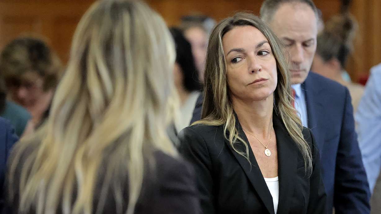 All stand as the jury files to the courtroom, to start their fifth day of deliberations in the murder trial for Karen Read in Norfolk Superior Court in Dedham, Mass., Monday.