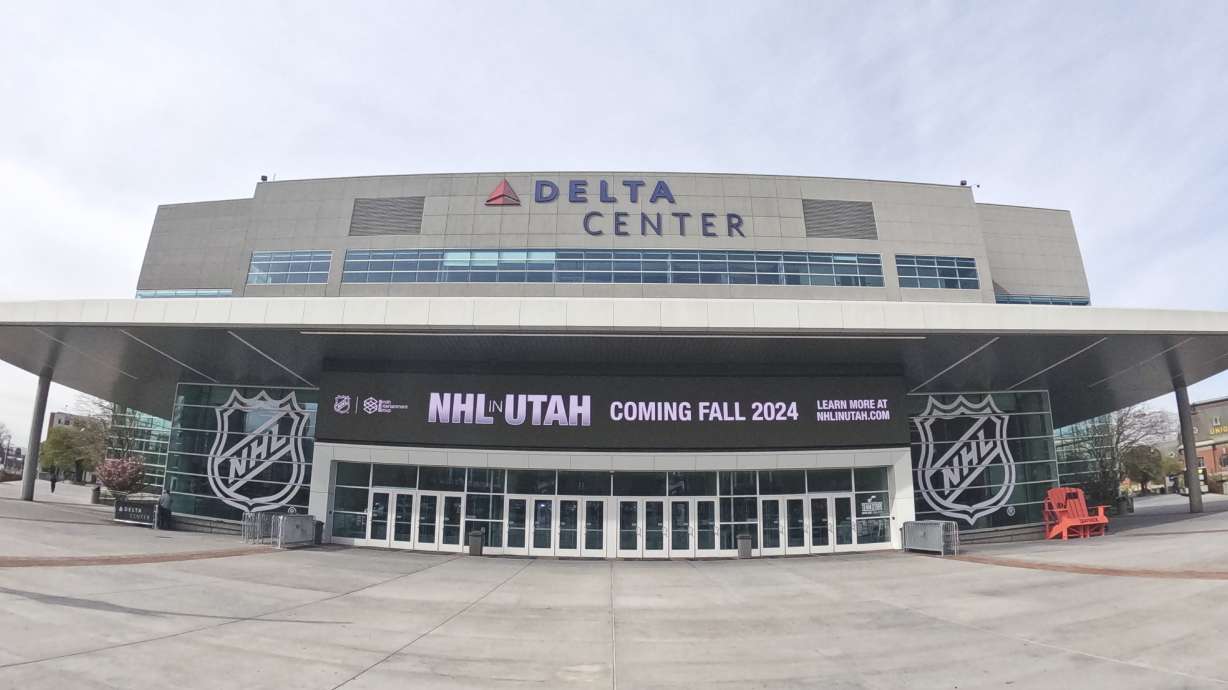 FILE - Signs celebrating the awarding of a new NHL team to Utah is displayed at the Delta Center, Friday, April 19, 2024, in Salt Lake City. Utah Hockey Club will be the name of the NHL team playing its games in Salt Lake City beginning this fall, with a long term identity still to come.