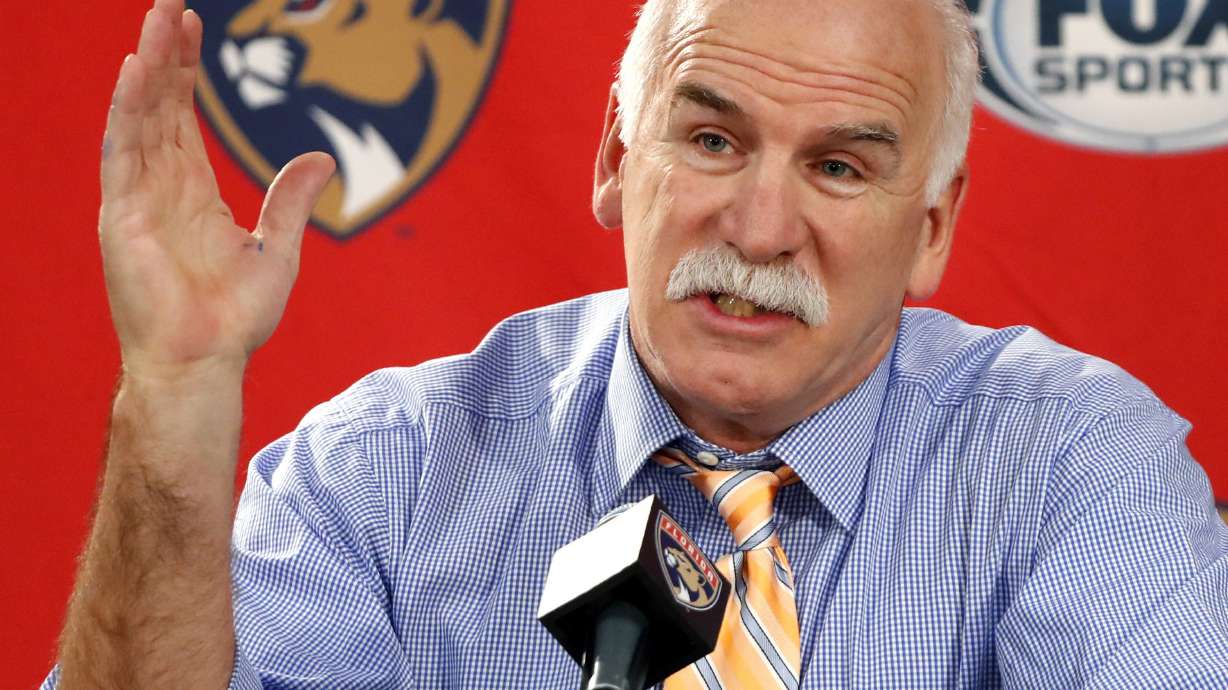 FILE - Florida Panthers head coach and former Chicago Blackhawks coach Joel Quenneville responds to a question during his first visit back to Chicago as a head coach before an NHL hockey game between the Blackhawks and the Panthers, Jan. 21, 2020. The NHL has reinstated executives Stan Bowman and Al MacIsaac and coach Quenneville. They are able to seek employment around the league effective immediately. Bowman, MacIsaac and Quenneville were banned from the league in October 2021 for their roles in the Blackhawks' mishandling of a video coach sexually assaulting a player in 2010.